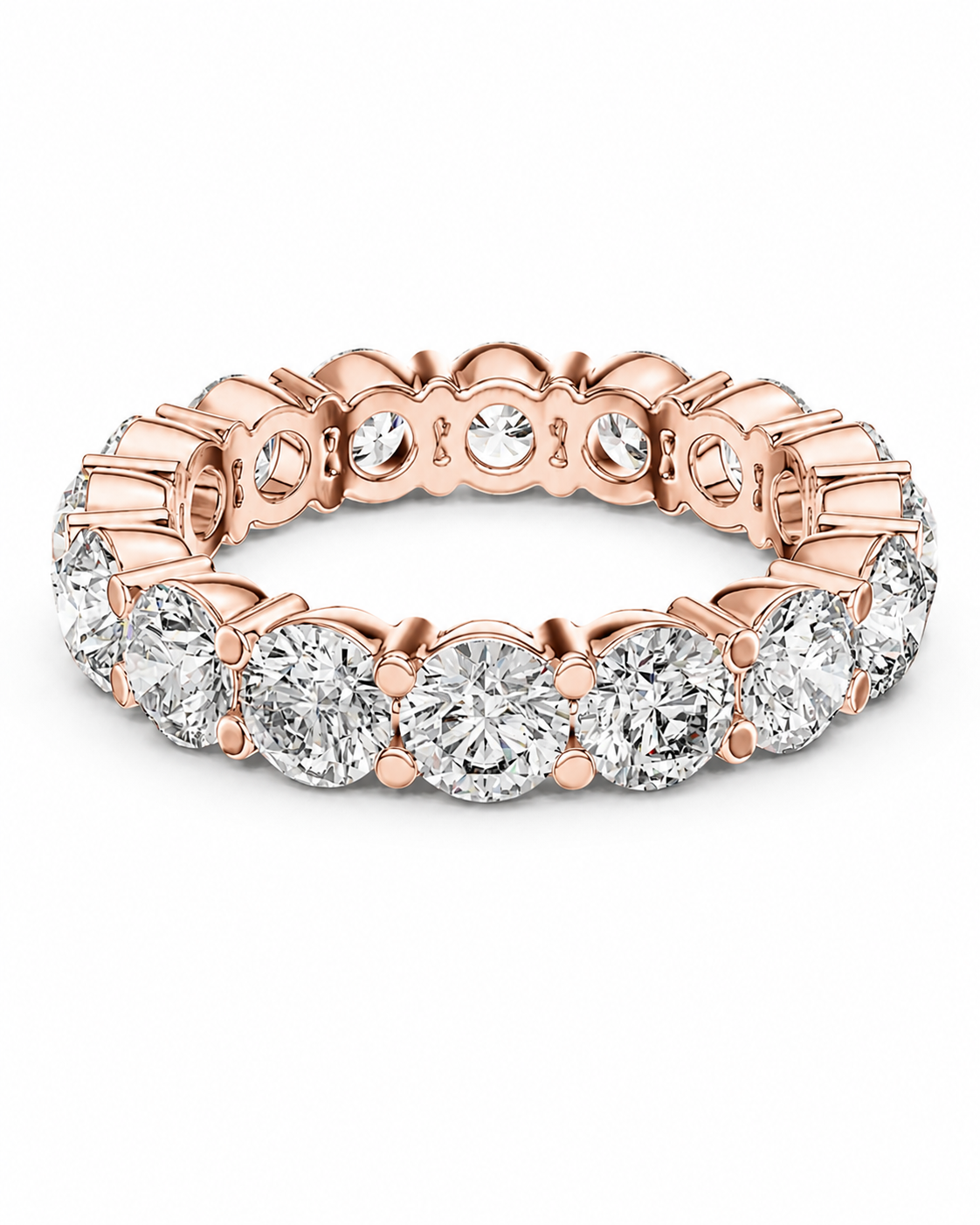 color_10K_RG, color_14K_RG &&	A rose gold eternity band ring featuring a continuous row of round brilliant-cut clear gemstones in a prong setting, shown on a clean white background.