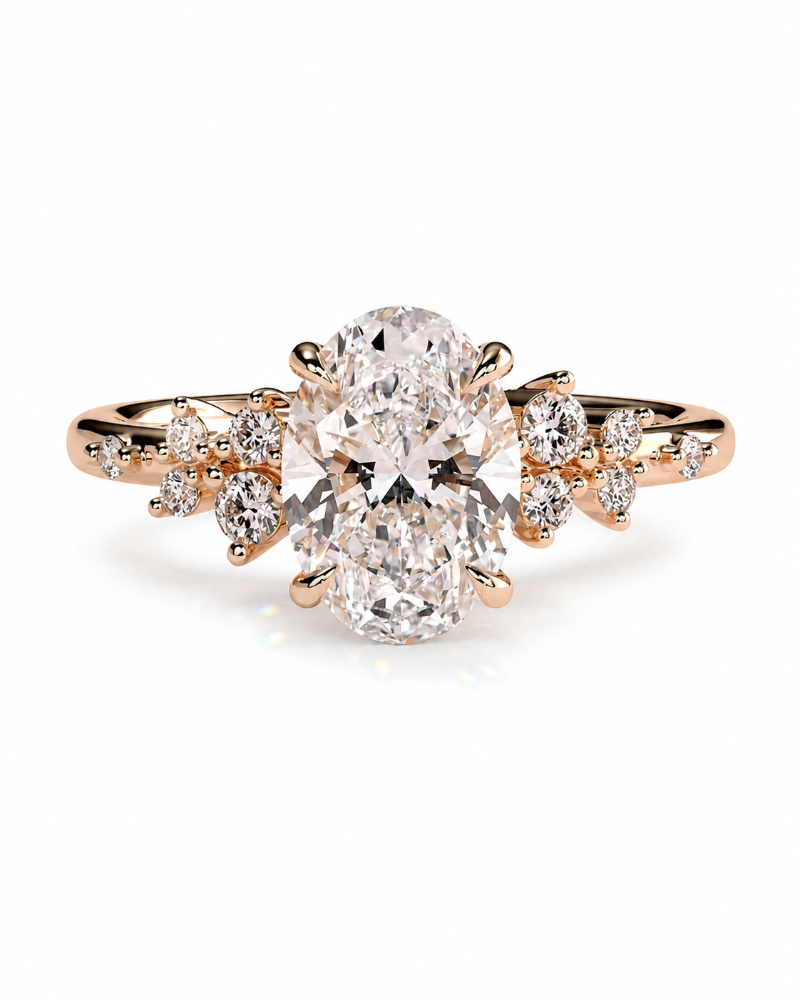 color_10K_RG, color_14K_RG &&An oval-cut diamond engagement ring in a rose gold setting, featuring smaller diamond accents along the shoulders of the band, set against a clean white background.