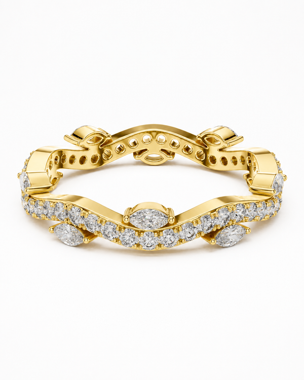 color_10K_YG, color_14K_YG &&	
A yellow gold bracelet featuring pave-set round and marquise-cut clear stones, photographed on a clean white background.