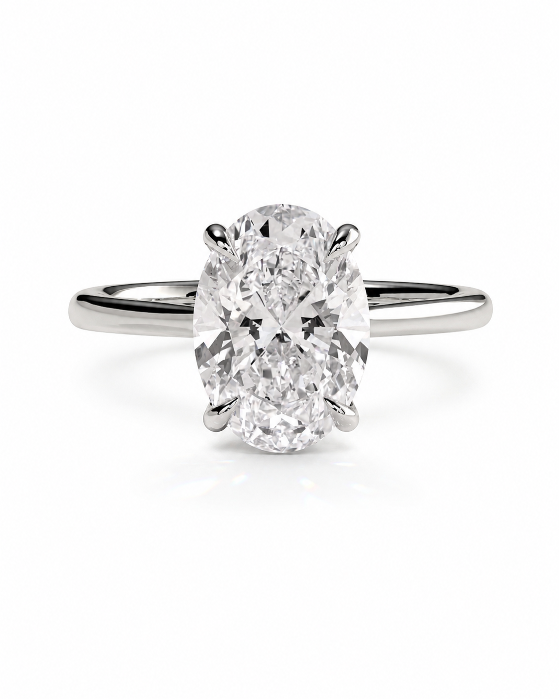 color_925_SIL,color_935_ARG,color_10K_WG, color_14K_WG &&An oval-cut diamond solitaire ring set in a polished silver-colored band, centered on a clean white background.