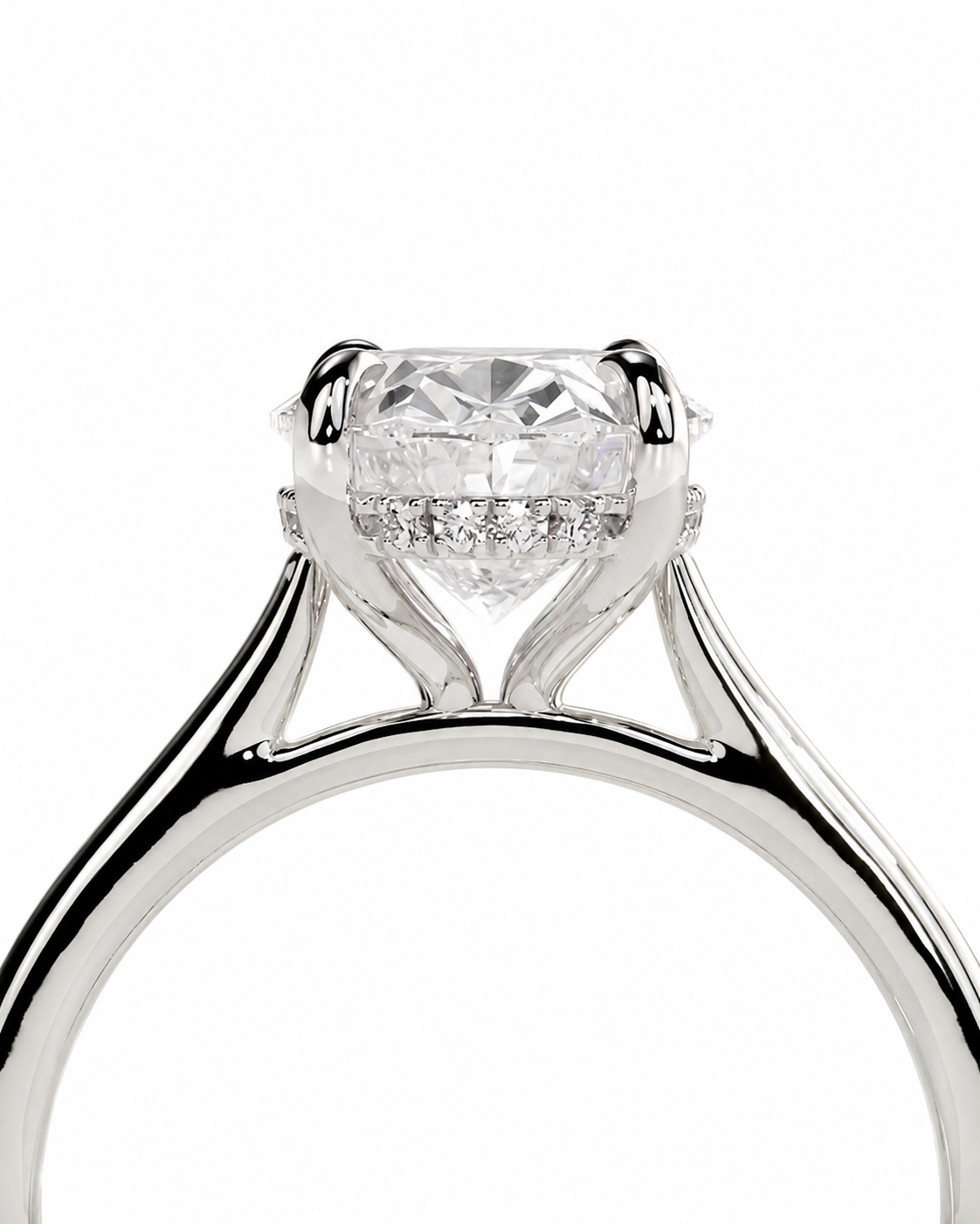 color_925_SIL,color_935_ARG,color_10K_WG, color_14K_WG &&A close-up studio shot of a silver-toned solitaire engagement ring with a large round-cut center stone and small accent stones in the halo, set against a plain white background.