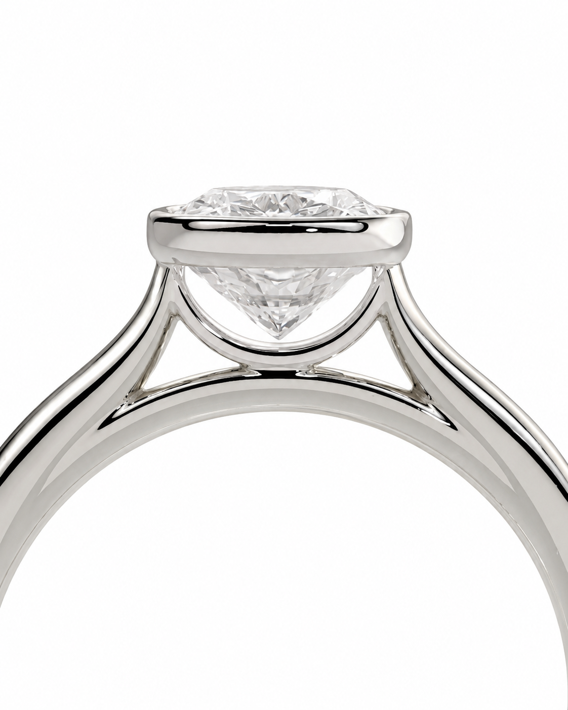 color_925_SIL,color_935_ARG,color_10K_WG, color_14K_WG &&Close-up of a solitaire diamond ring in a polished silver-colored metal setting, showing the diamond and part of the band against a white background.