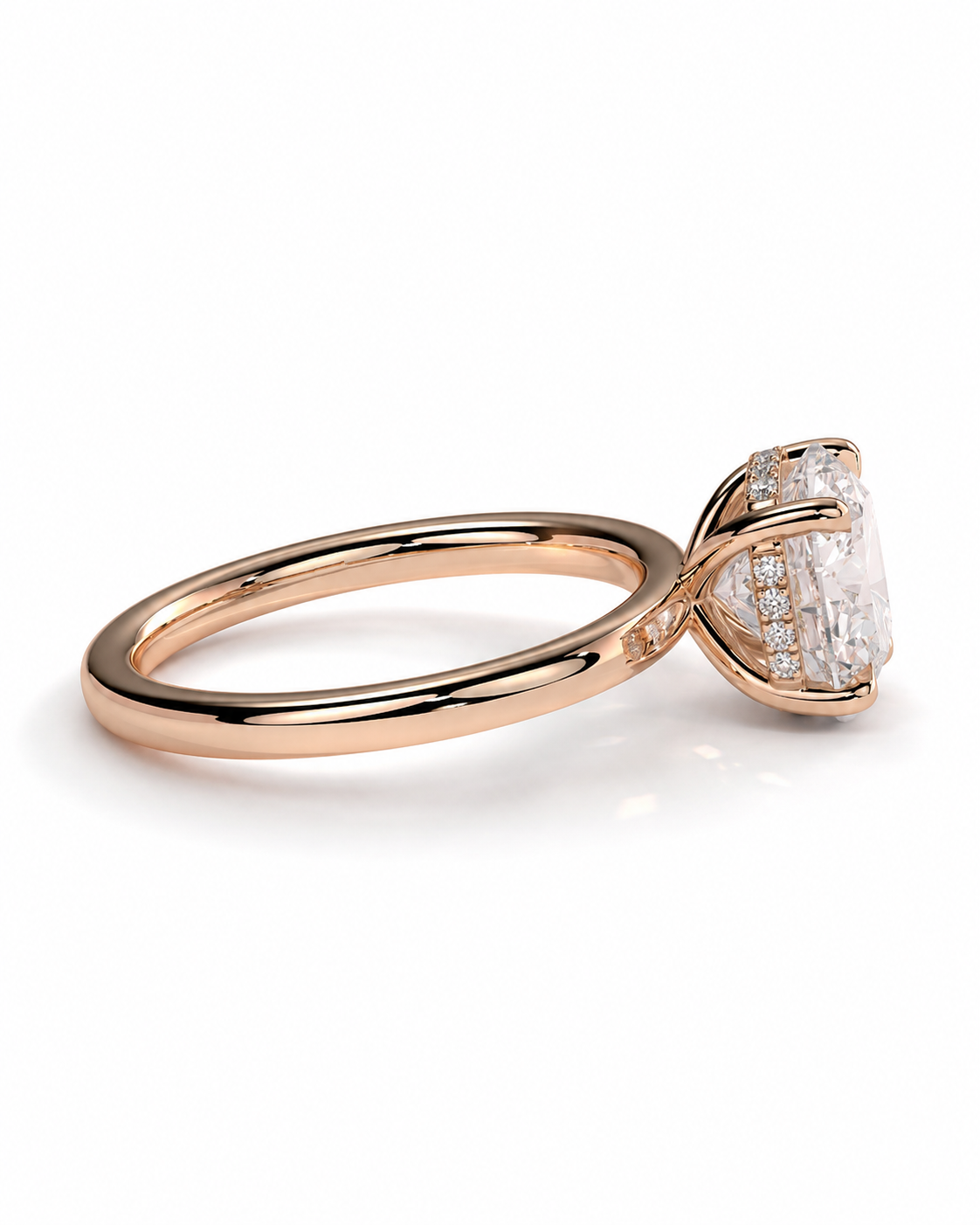 color_10K_RG, color_14K_RG &&A rose gold engagement ring featuring a large oval-cut clear center stone in a prong setting, accented with small round stones along the band, shown on a clean white background.