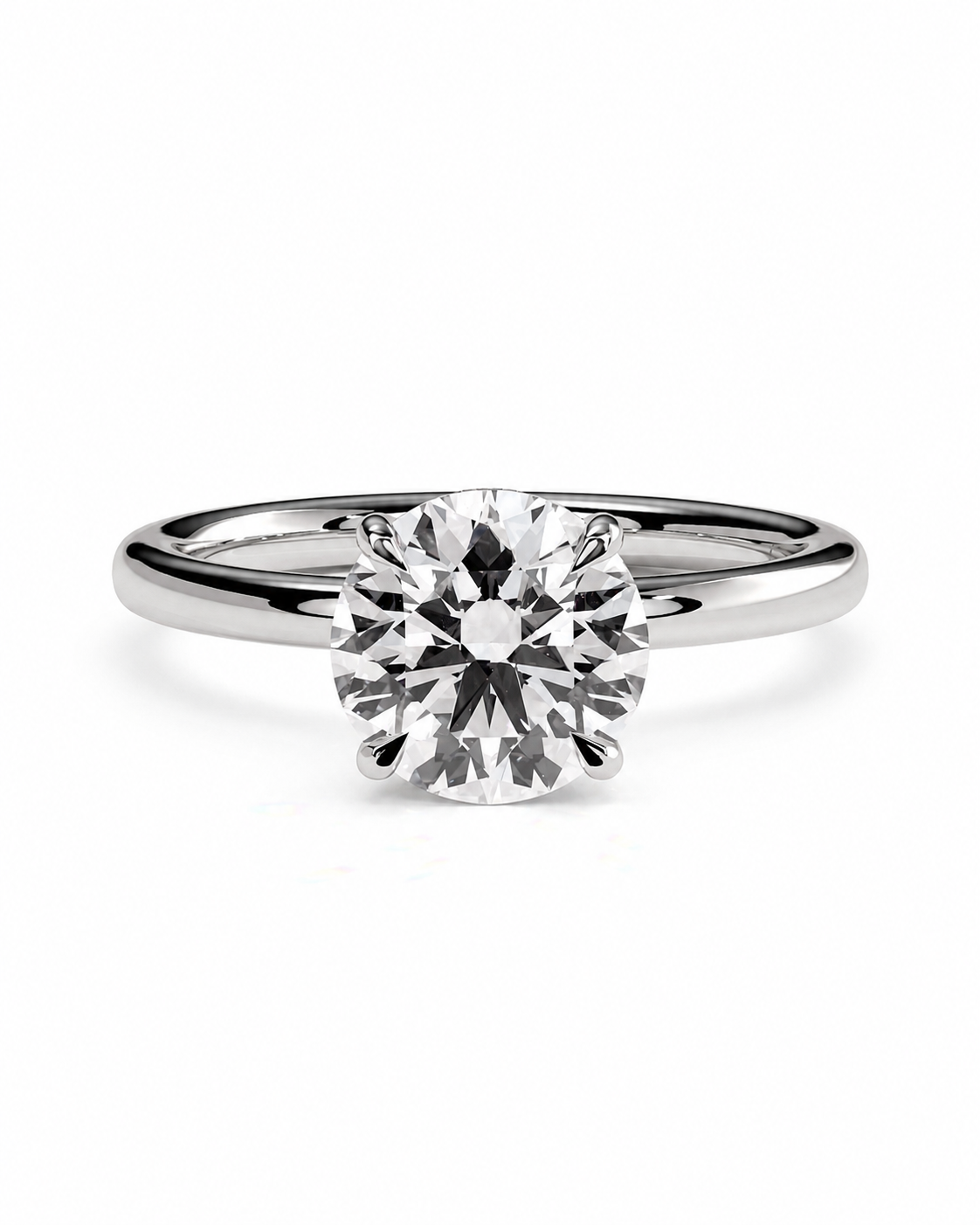 color_925_SIL,color_935_ARG,color_10K_WG, color_14K_WG &&A classic solitaire engagement ring featuring a round brilliant-cut diamond set in a polished white gold or platinum band, centered on a clean white background.