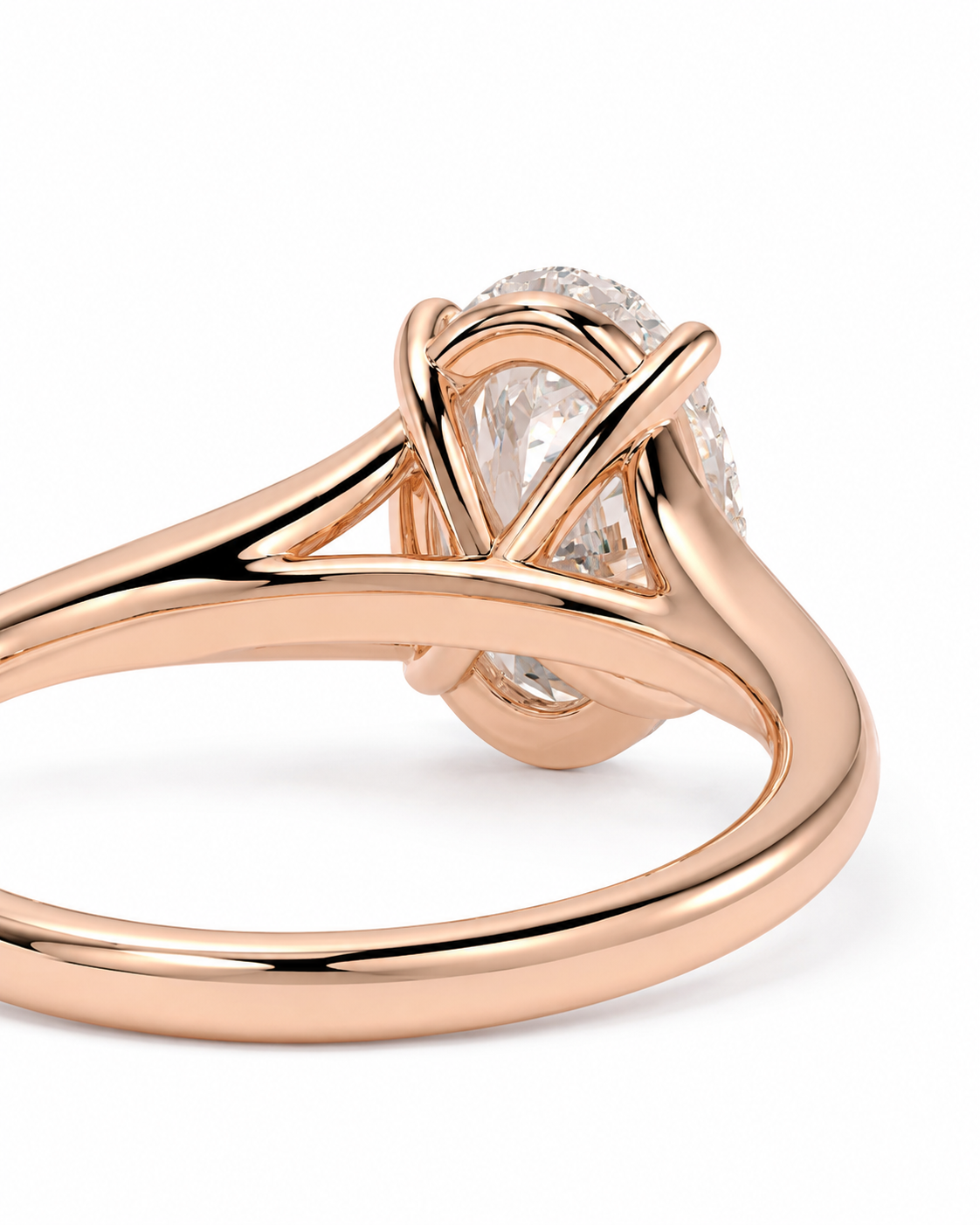 color_10K_RG, color_14K_RG &&Rose gold ring with a pear-cut clear center stone and small side stones in a polished four-prong setting, shown on a white background.