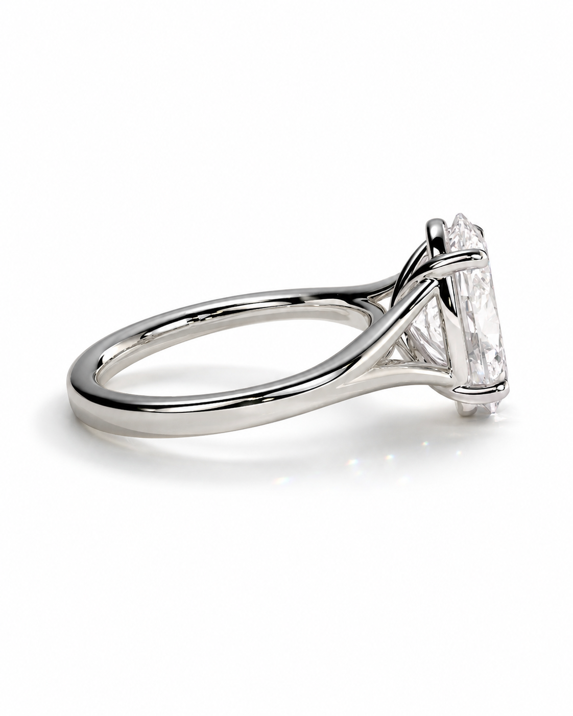 color_925_SIL,color_935_ARG,color_10K_WG, color_14K_WG &&A silver-toned solitaire engagement ring with a marquise-cut clear gemstone in a four-prong setting, shown on a clean white background.