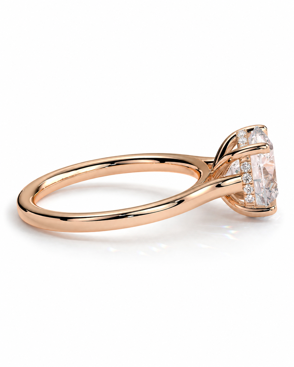 color_10K_RG, color_14K_RG &&A rose gold engagement ring featuring a large cushion-cut clear gemstone in a prong setting, accented by smaller diamonds along the band, shown on a clean white background.