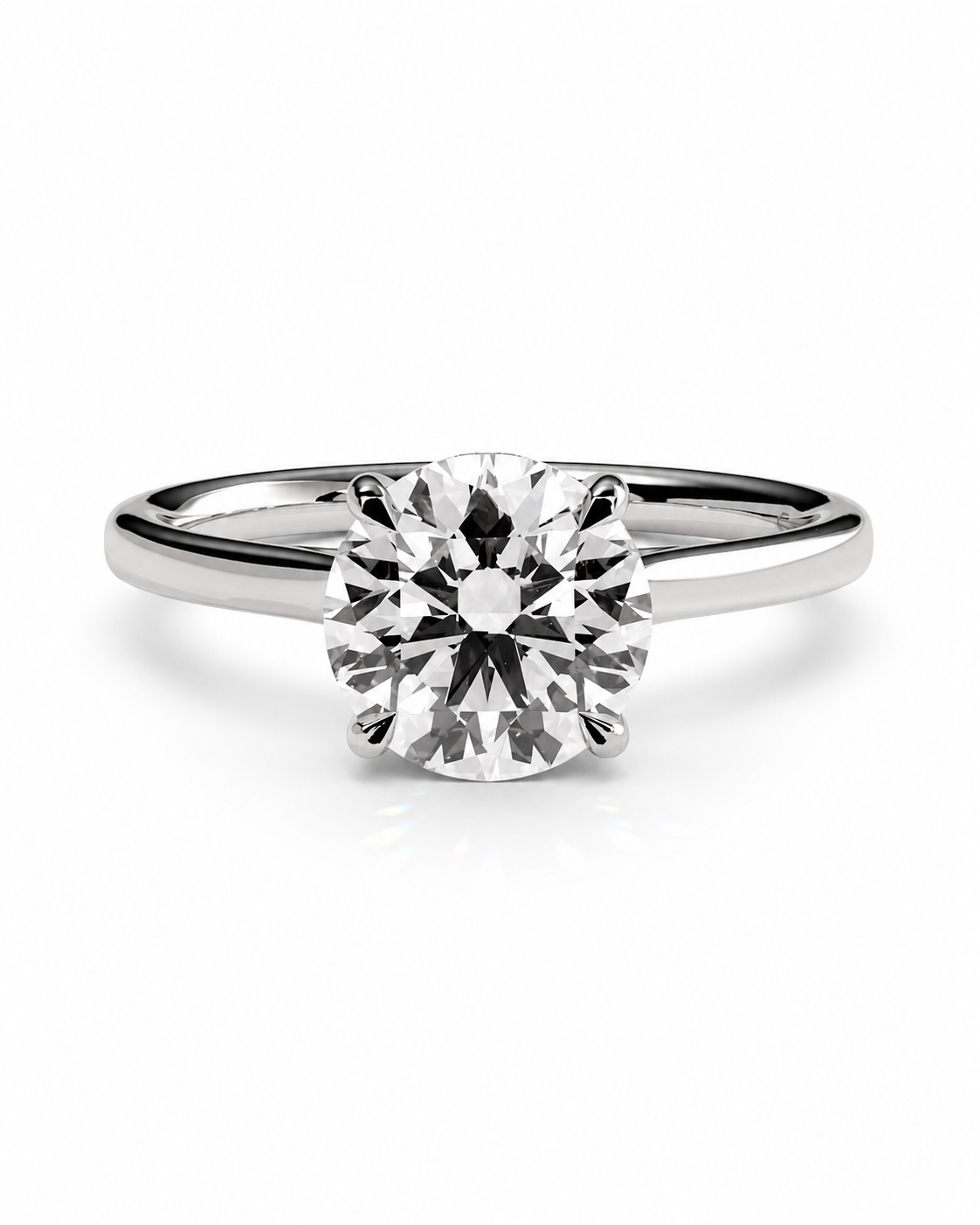 color_925_SIL,color_935_ARG,color_10K_WG, color_14K_WG &&A classic solitaire engagement ring featuring a round brilliant-cut diamond set in a polished silver-colored band, shown on a clean white background.
