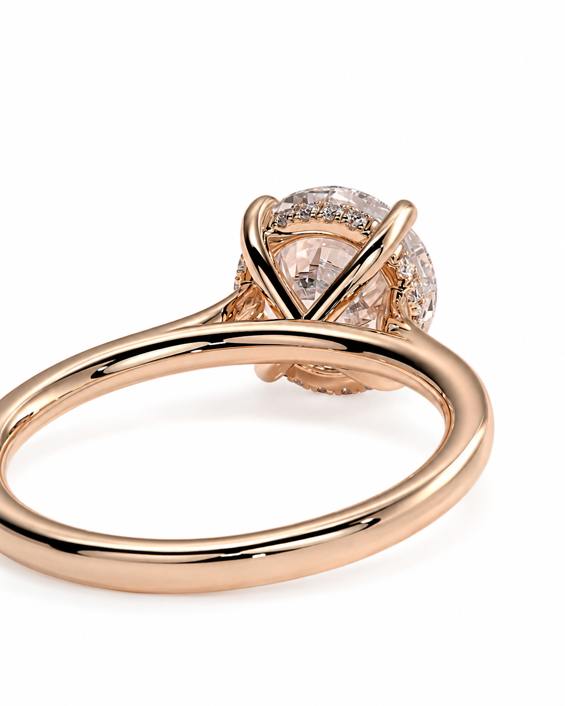 color_10K_RG, color_14K_RG &&A close-up shot of a rose gold ring with a round-cut center stone and small pave accents, set against a plain white background.