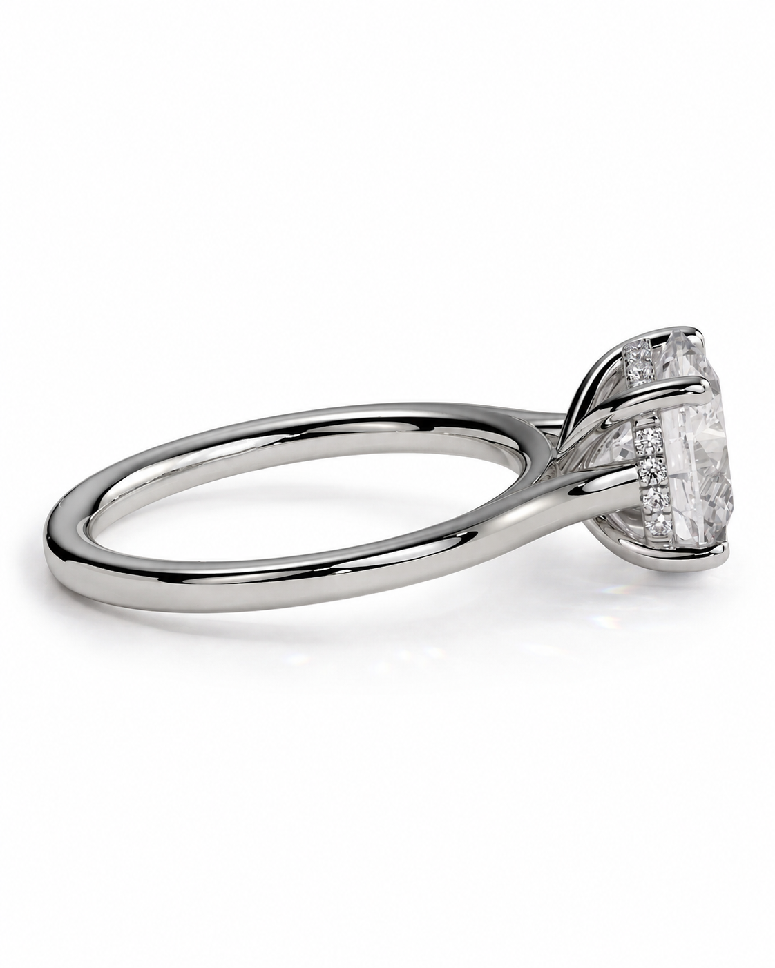 color_925_SIL,color_935_ARG,color_10K_WG, color_14K_WG &&A silver-toned engagement ring featuring a large rectangular emerald-cut clear center stone with smaller accent stones along the side, set against a clean white background.