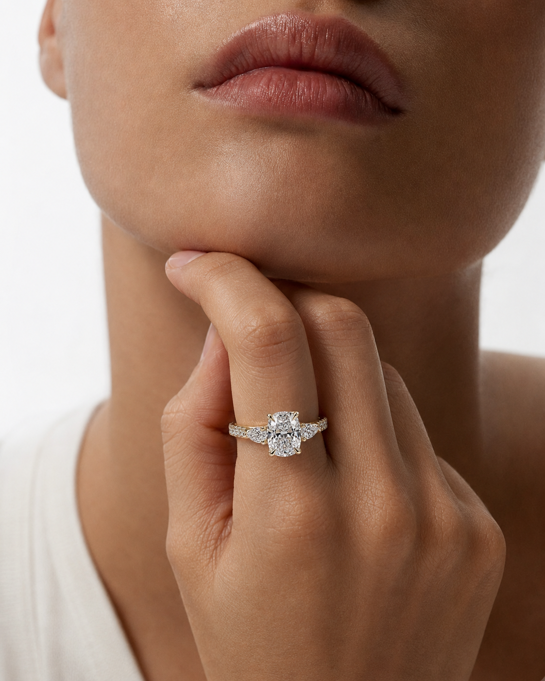 color_10K_YG, color_14K_YG &&Cushion moissanite three stone engagement ring with marquise side stones front view
