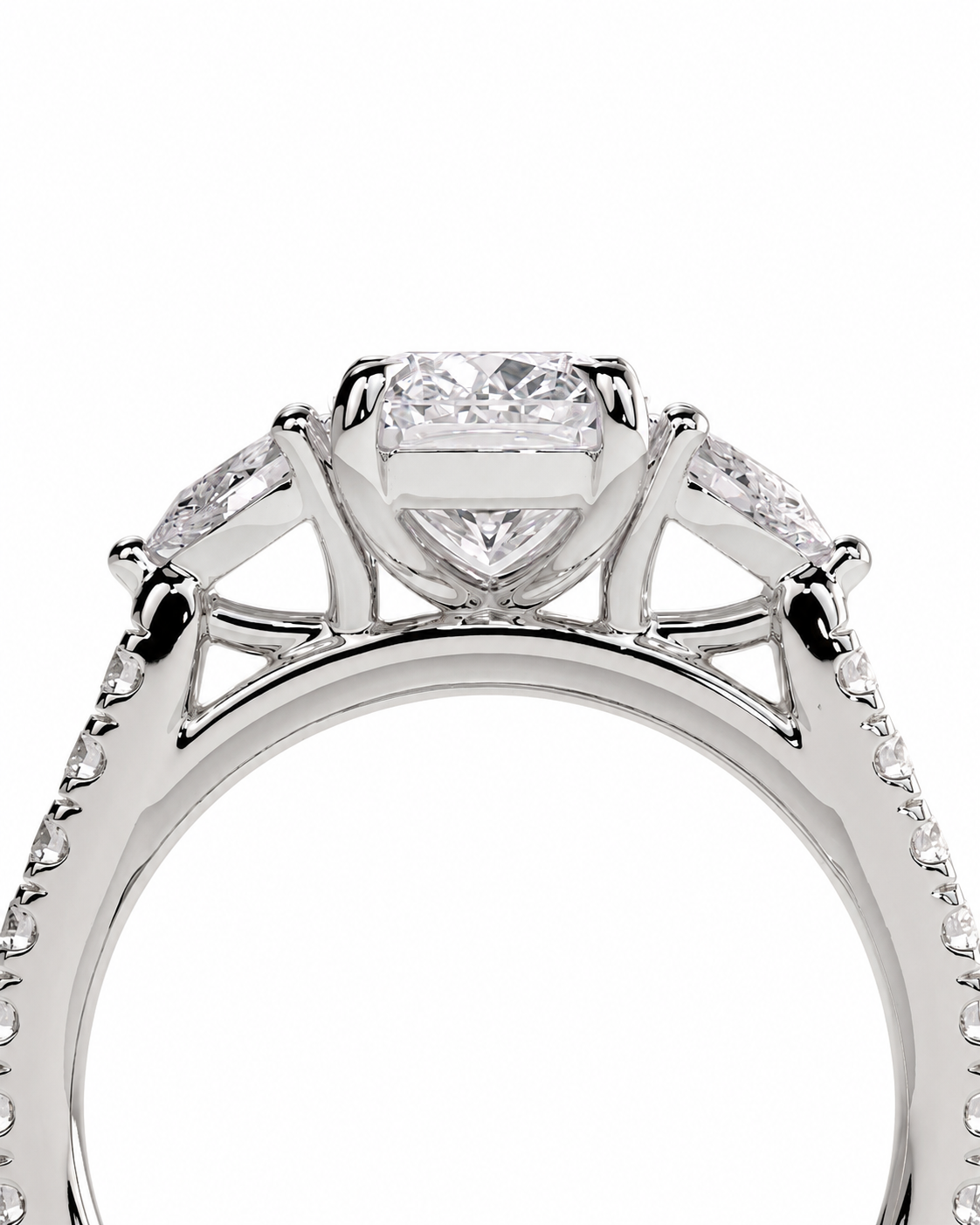 color_925_SIL,color_935_ARG,color_10K_WG, color_14K_WG &&Close-up of a white gold or platinum engagement ring featuring a central princess-cut diamond, side marquise-cut diamonds, and a pave-set diamond band, shown on a white background.