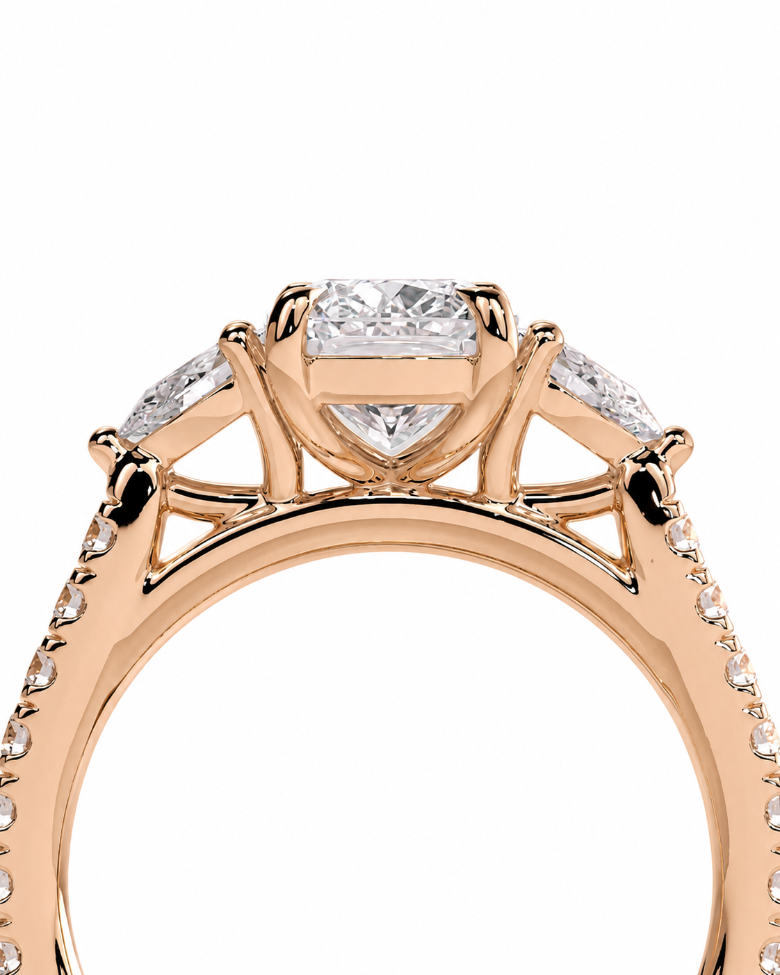 color_10K_RG, color_14K_RG &&A close-up of a rose gold ring featuring a central rectangular diamond surrounded by marquise-cut side diamonds, with small pave diamonds along the band, set against a plain white background.