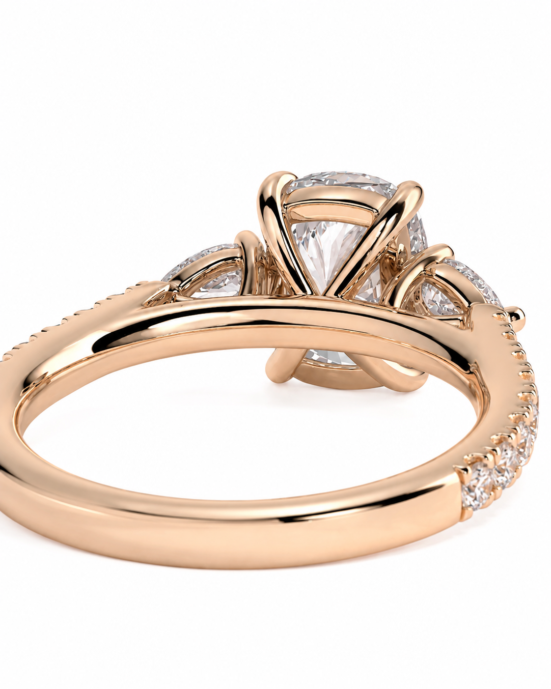 color_10K_RG, color_14K_RG &&A rose gold engagement ring featuring a large round brilliant-cut center stone in a prong setting, with smaller round stones along the shoulders and a pave band, shown on a white background.