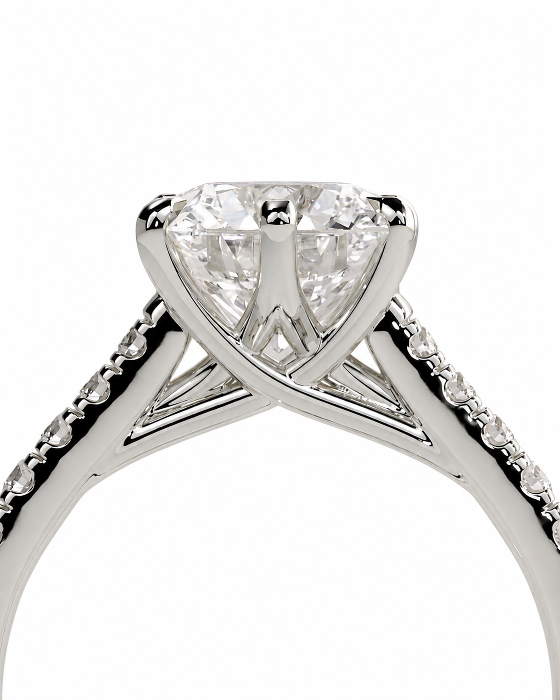 color_925_SIL,color_935_ARG,color_10K_WG, color_14K_WG &&A close-up studio shot of a silver-tone diamond engagement ring with a pear-cut center stone and pave-set diamonds along the shank, shown against a plain white background.