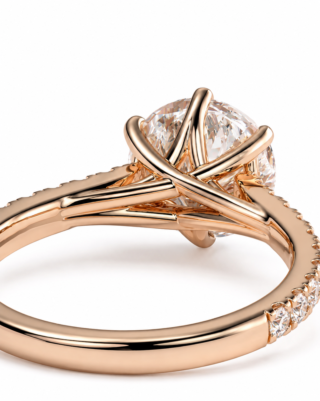 color_10K_RG, color_14K_RG &&Rose gold ring with a large round clear gemstone in a unique crisscross prong setting, shown on a white background.