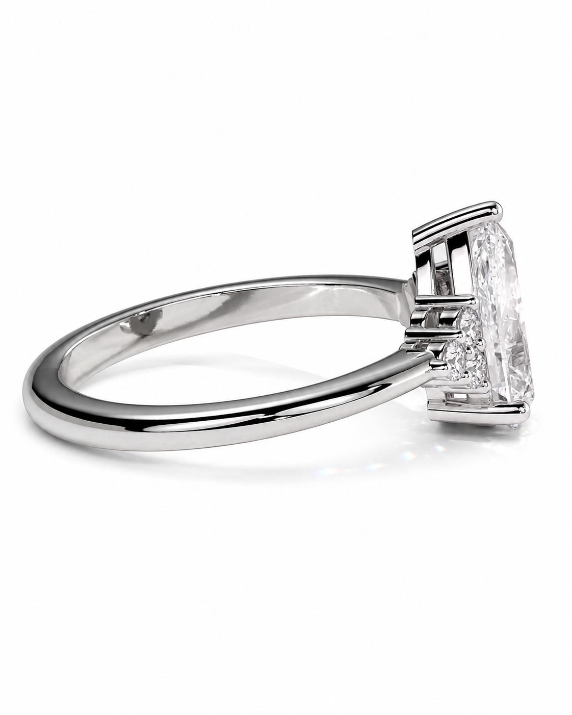 color_925_SIL,color_935_ARG,color_10K_WG, color_14K_WG &&A silver-toned diamond ring with a large emerald-cut center stone and smaller side stones, shown in a side profile view on a white background.