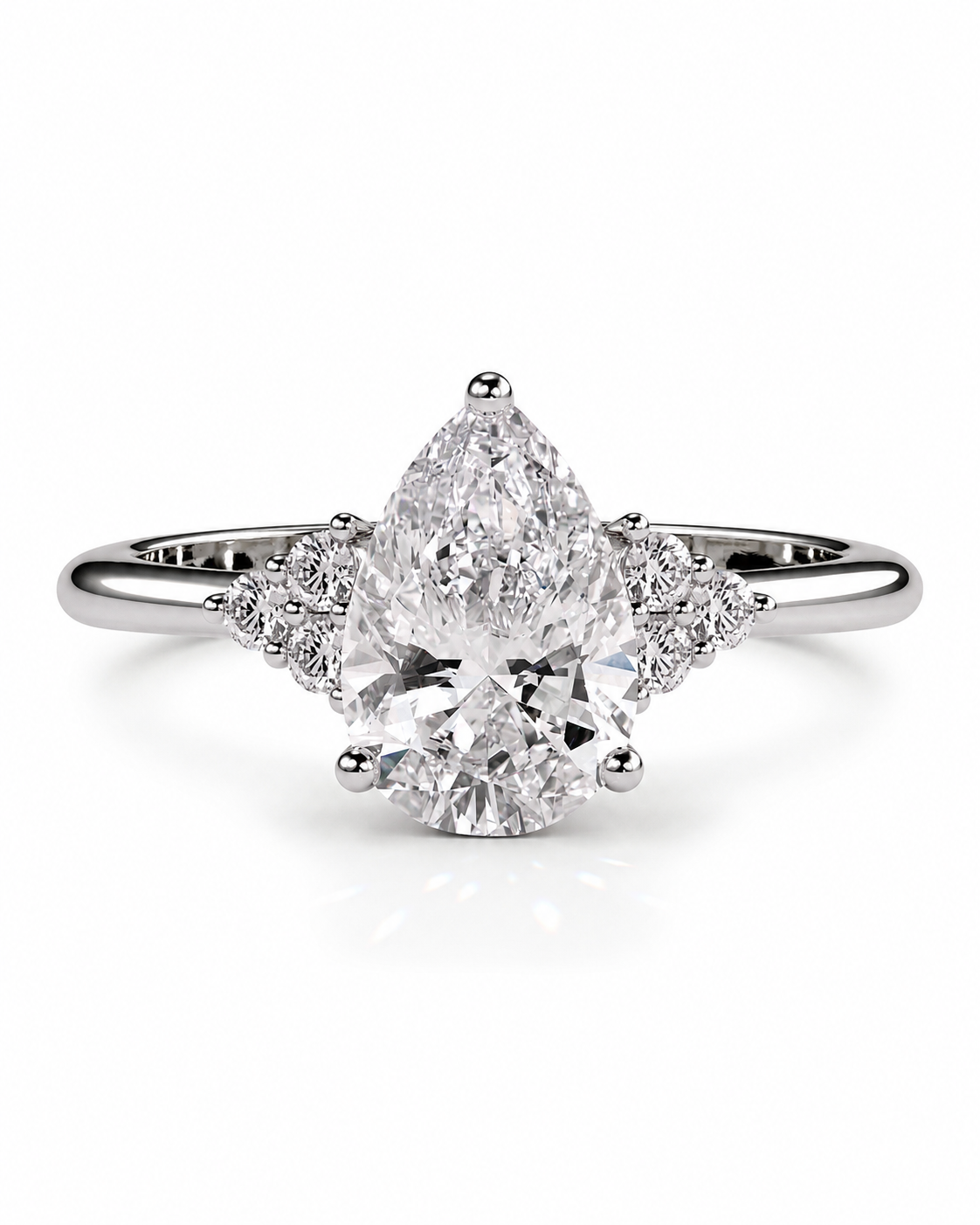 color_925_SIL,color_935_ARG,color_10K_WG, color_14K_WG &&A pear-cut diamond engagement ring in a silver-toned setting with small accent diamonds on the band, shown on a clean white background.