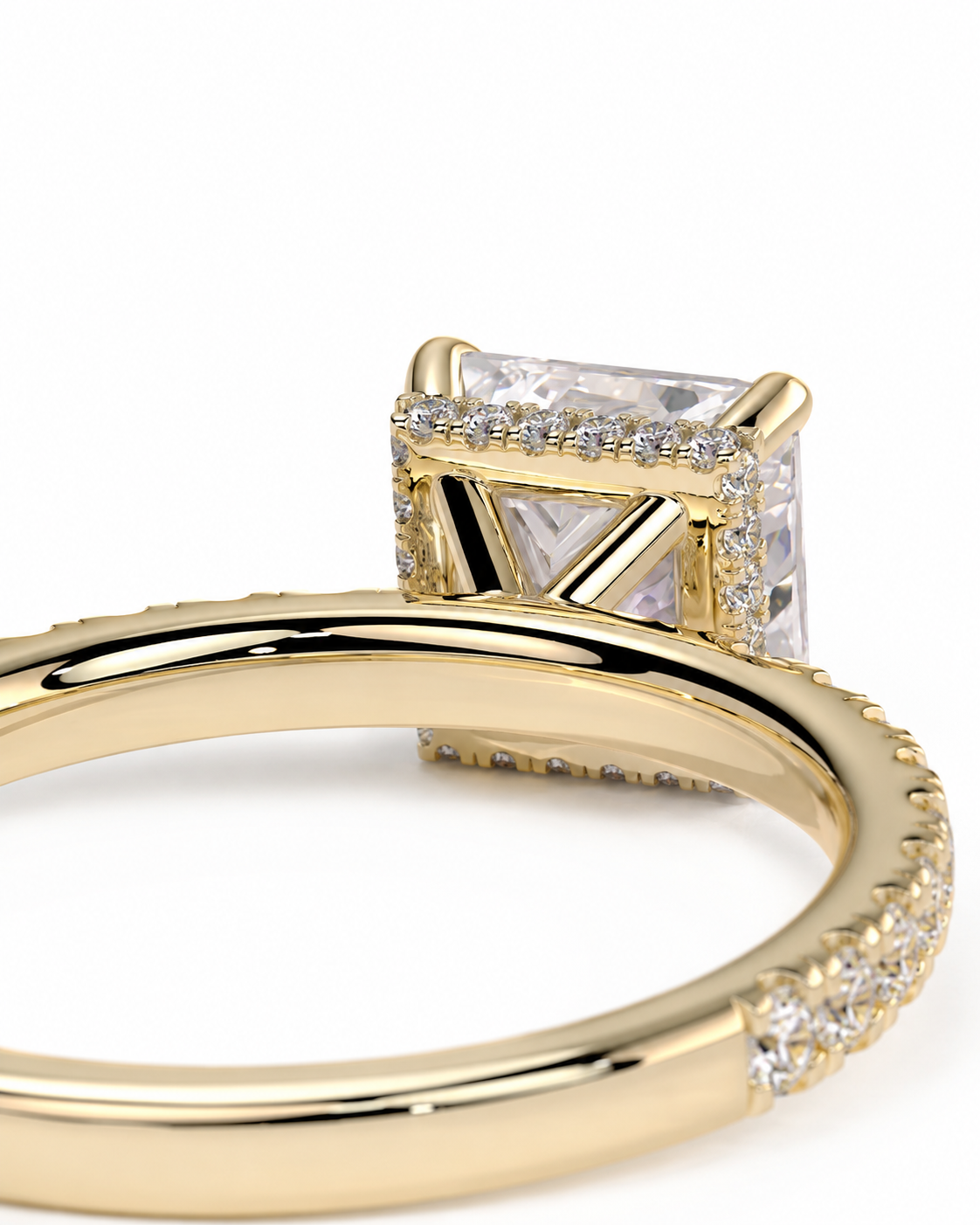 color_10K_YG, color_14K_YG &&Side profile of a Princess cut moissanite ring highlighting the hidden halo gallery.
