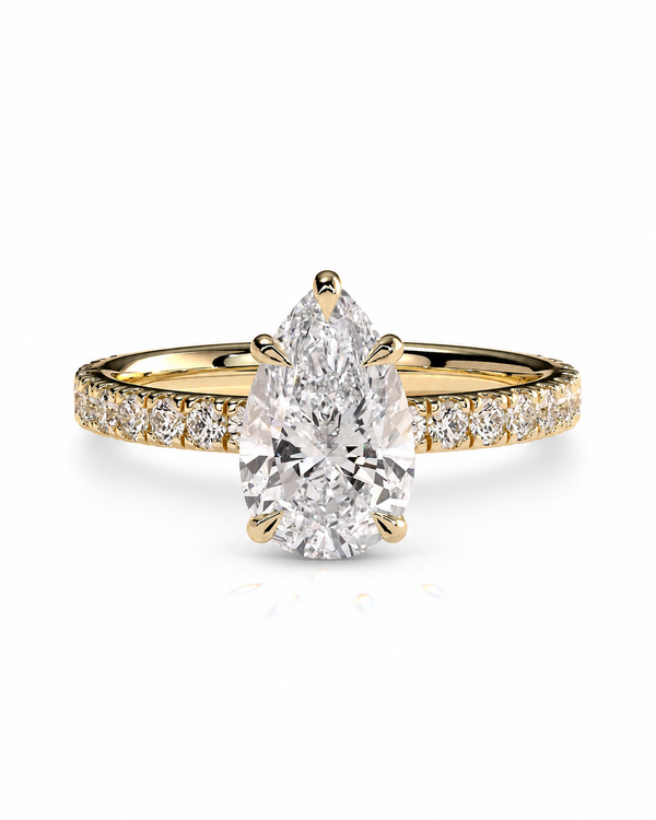 color_10K_YG, color_14K_YG &&Pear moissanite engagement ring with a sparkling pave band front view.
