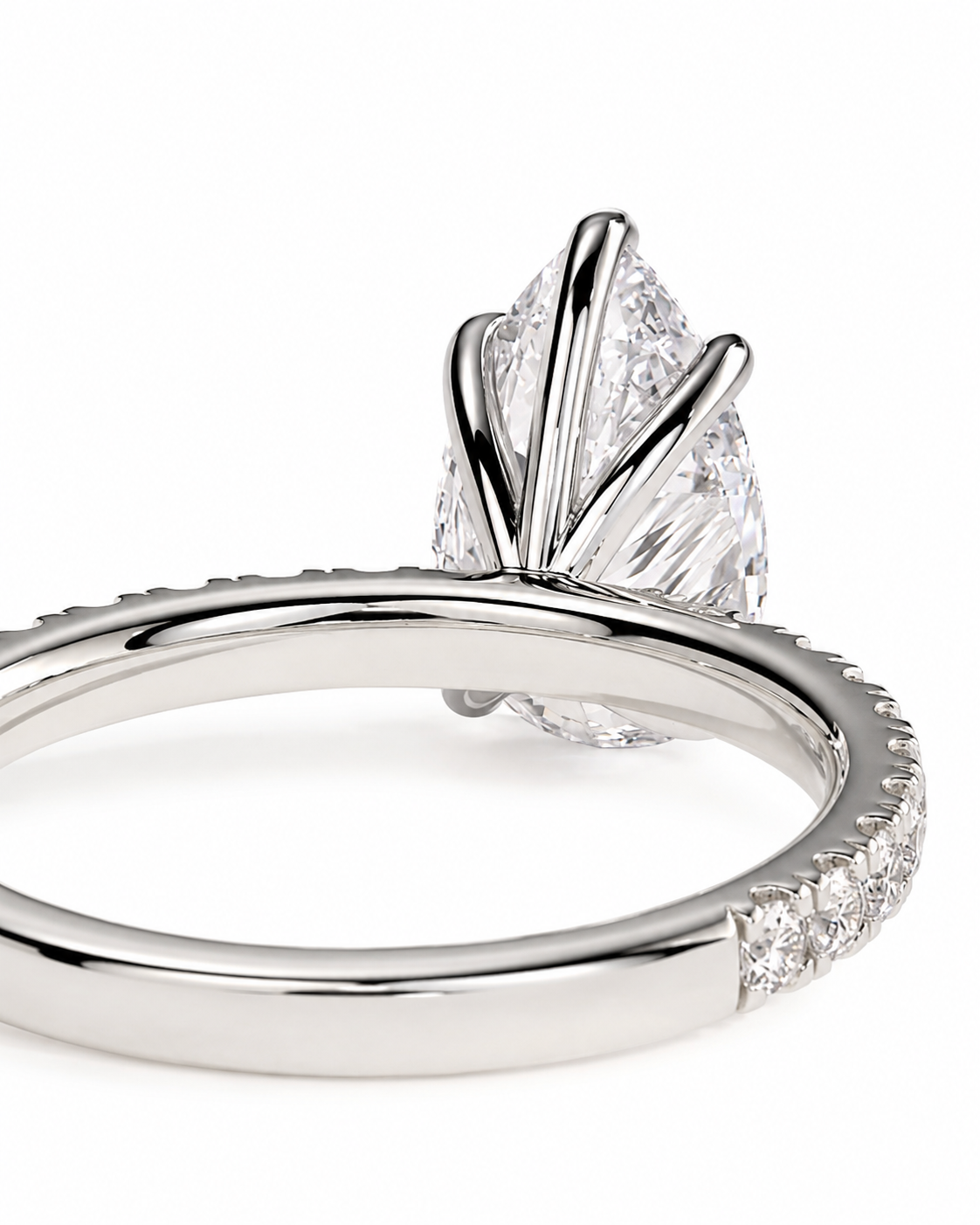 color_925_SIL,color_935_ARG,color_10K_WG, color_14K_WG &&A close-up studio shot of a silver engagement ring featuring a marquise-cut diamond center stone in a fan-like prong setting, with a pave band on a white background.