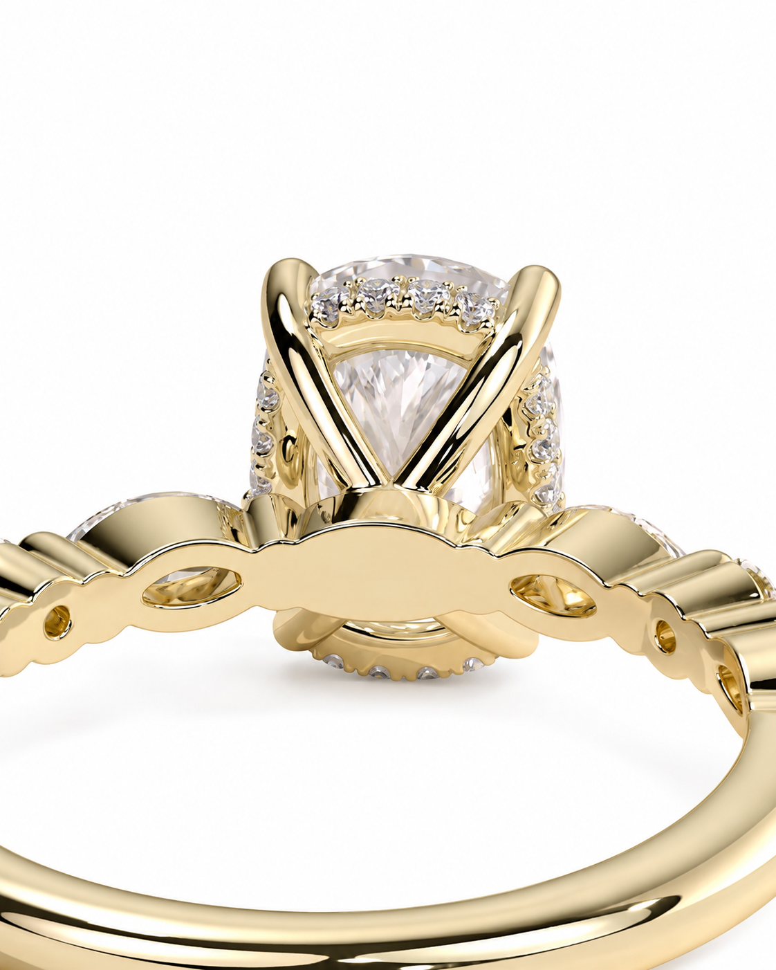 color_10K_YG, color_14K_YG &&Close-up of a yellow gold ring with a large pear-cut center stone and small surrounding stones, shown on a white background.