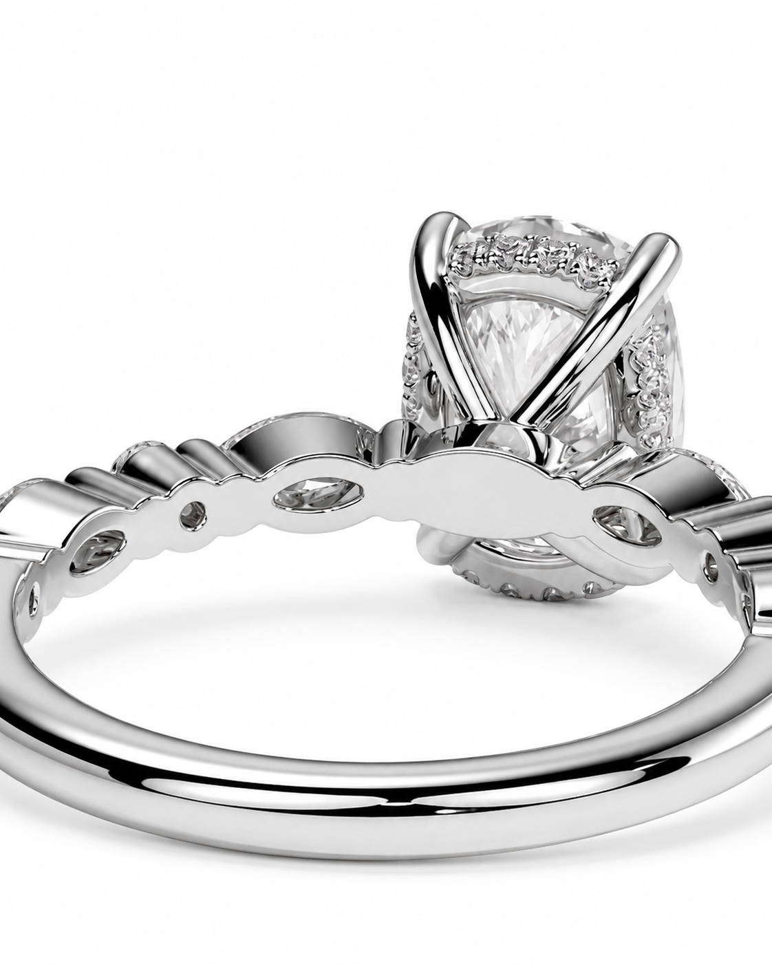 color_925_SIL,color_935_ARG,color_10K_WG, color_14K_WG &&A close-up studio shot of a silver-toned ring with a large clear marquise-cut center stone and smaller accent stones, shown against a plain white background.