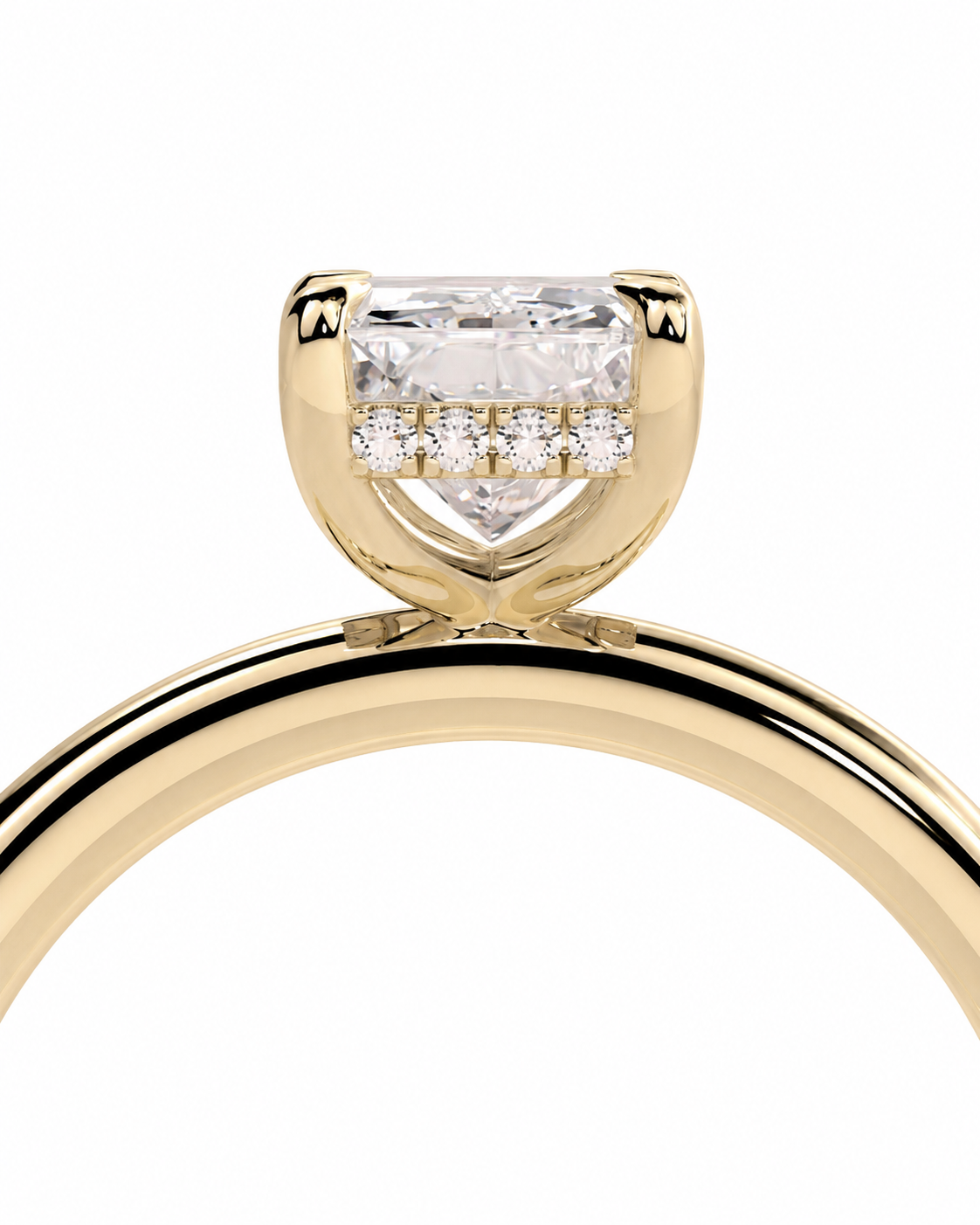 color_10K_YG, color_14K_YG &&A close-up of a yellow gold ring featuring a rectangular clear center stone and three small round stones in a halo setting, shown against a plain white background.