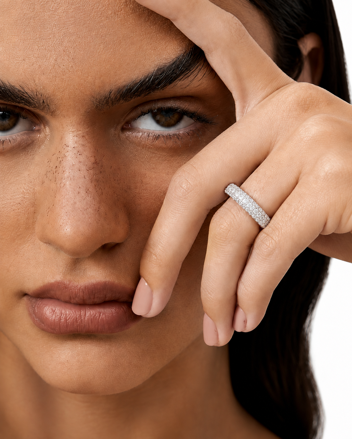 color_925_SIL,color_935_ARG,color_10K_WG, color_14K_WG &&	
A close-up lifestyle shot of a model wearing a silver band ring paved with small clear stones on her ring finger, set against a clean white background.