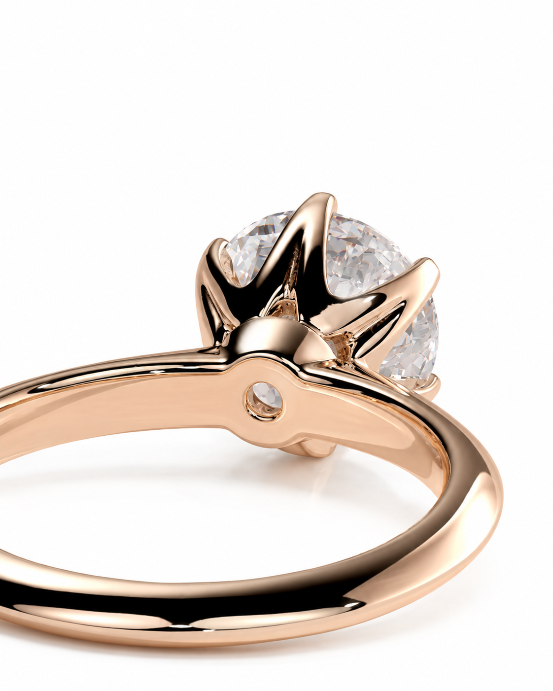 color_10K_RG, color_14K_RG &&A close-up shot of a rose gold ring with a brilliant round-cut clear gemstone in a prong setting, shown on a clean white background.