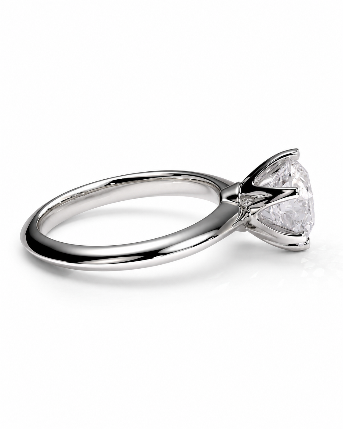 color_925_SIL,color_935_ARG,color_10K_WG, color_14K_WG &&A silver-toned solitaire engagement ring with a round brilliant-cut diamond, shown in a three-quarter side view on a clean white background.