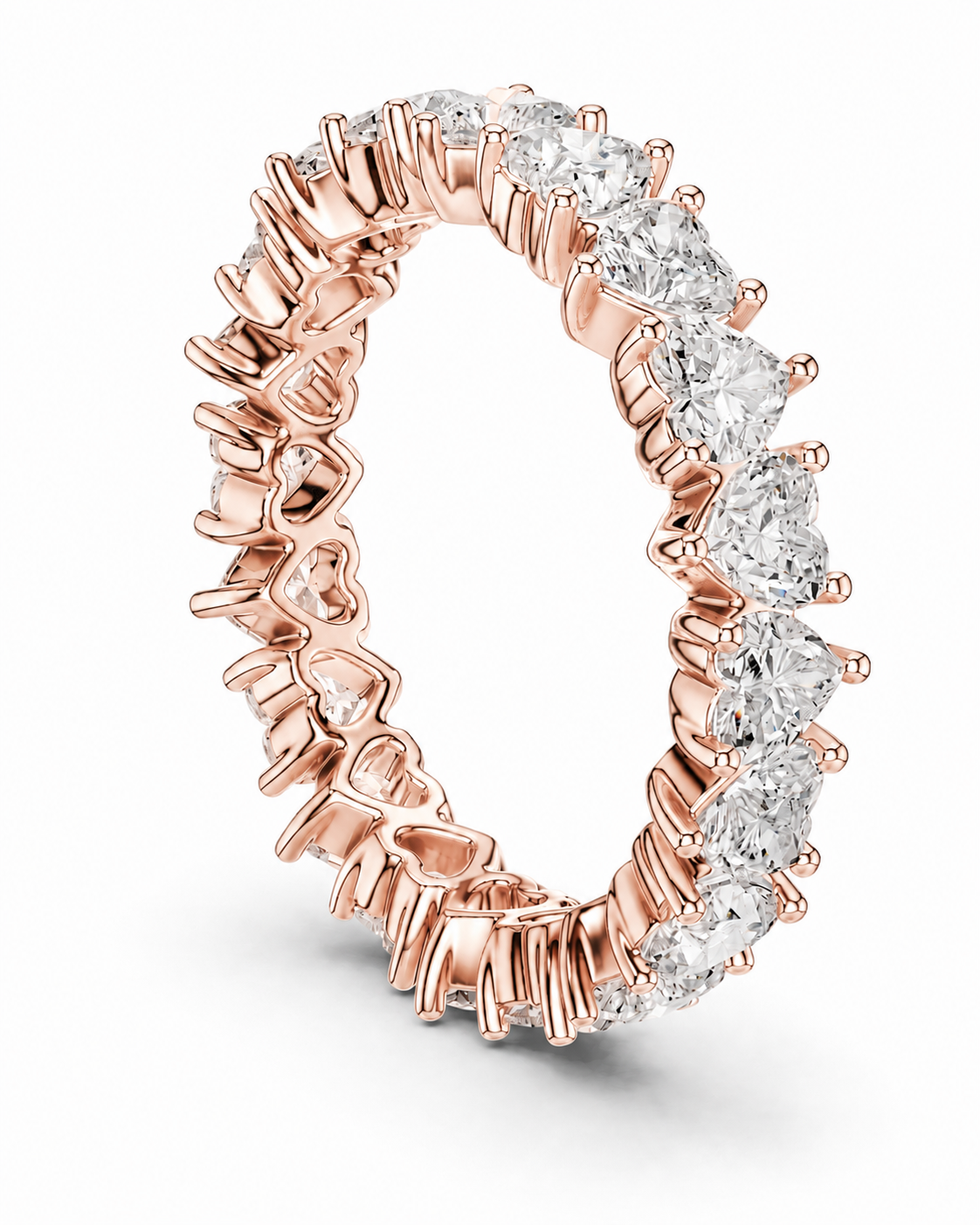 color_10K_RG, color_14K_RG &&	A rose gold eternity ring featuring a continuous row of round brilliant-cut clear gemstones in a prong setting, shown on a clean white background.