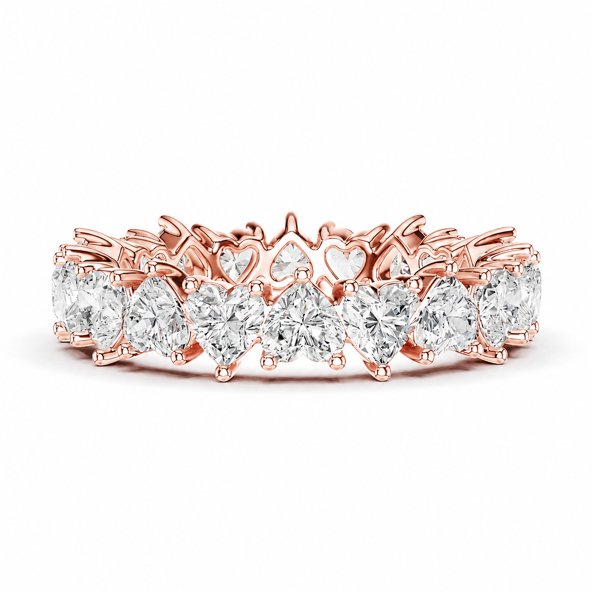 color_10K_RG, color_14K_RG &&	A rose gold eternity band ring featuring a continuous row of clear gemstones, including pear-cut and heart-shaped stones, set in a polished rose gold band against a plain white background.