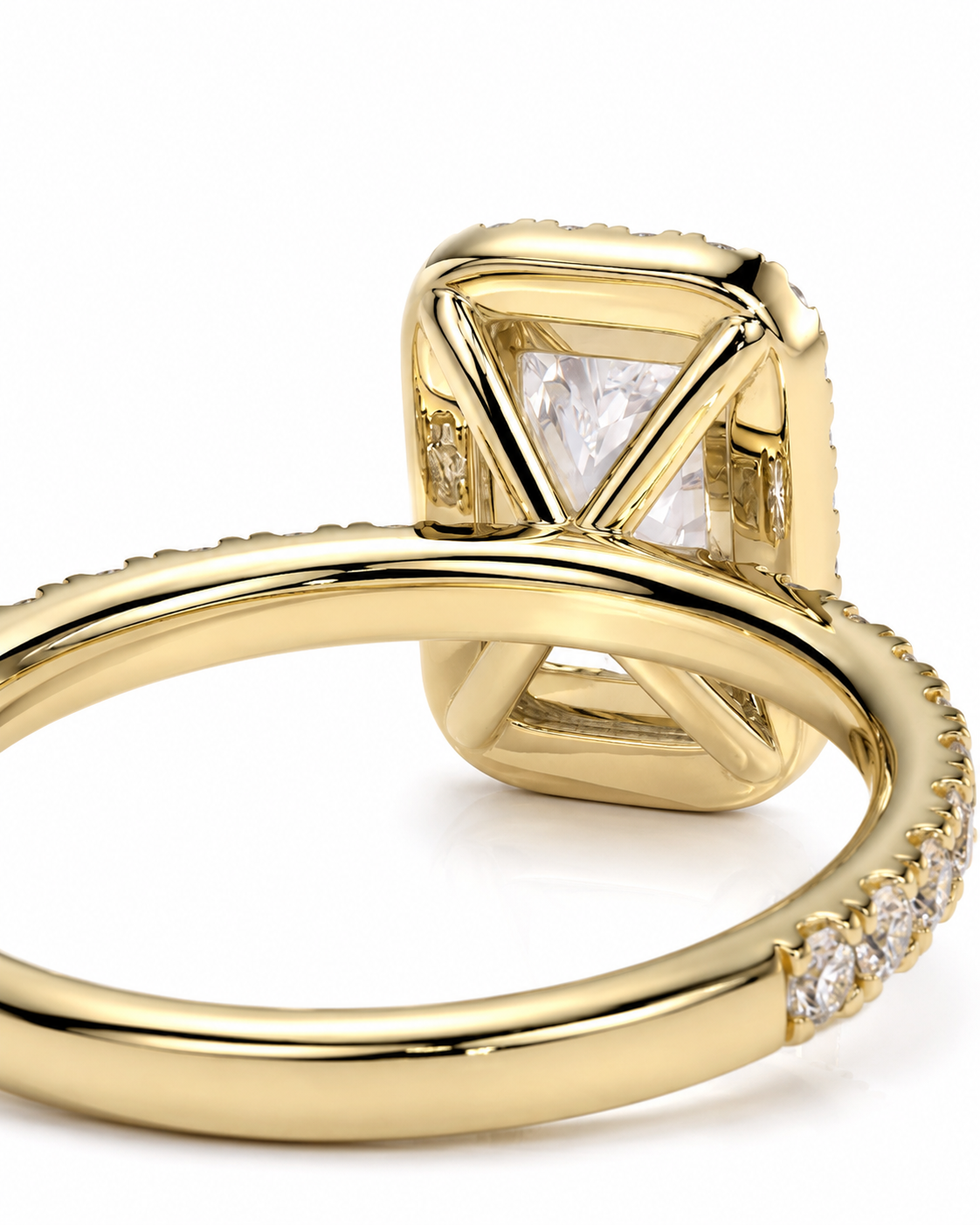 color_10K_YG, color_14K_YG &&A close-up shot of a gold ring featuring a square-cut clear gemstone in a unique geometric setting, with small pave diamonds along the band, on a white background.