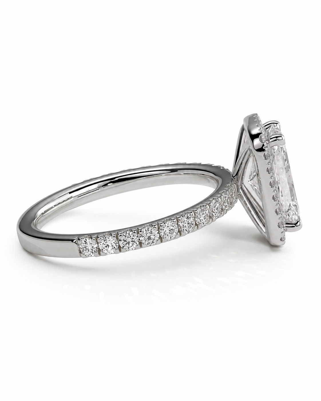 color_925_SIL,color_935_ARG,color_10K_WG, color_14K_WG &&A silver-toned diamond ring featuring a large rectangular emerald-cut center stone in a prong setting, with a pave band of small round diamonds, shown on a white background.