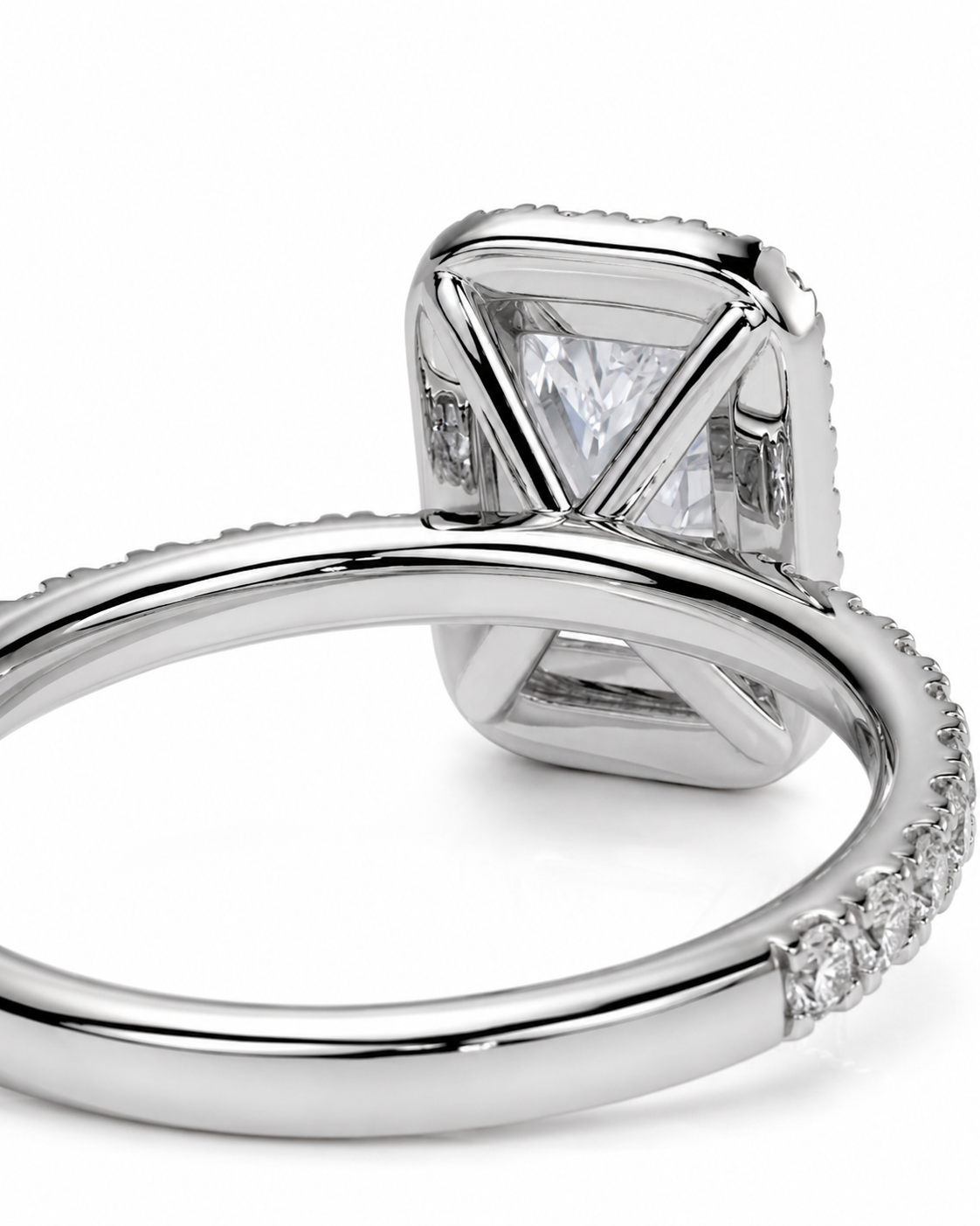 color_925_SIL,color_935_ARG,color_10K_WG, color_14K_WG &&A close-up studio shot of a silver-toned ring featuring a large square cushion-cut clear gemstone in a geometric prong setting, with a pave band.