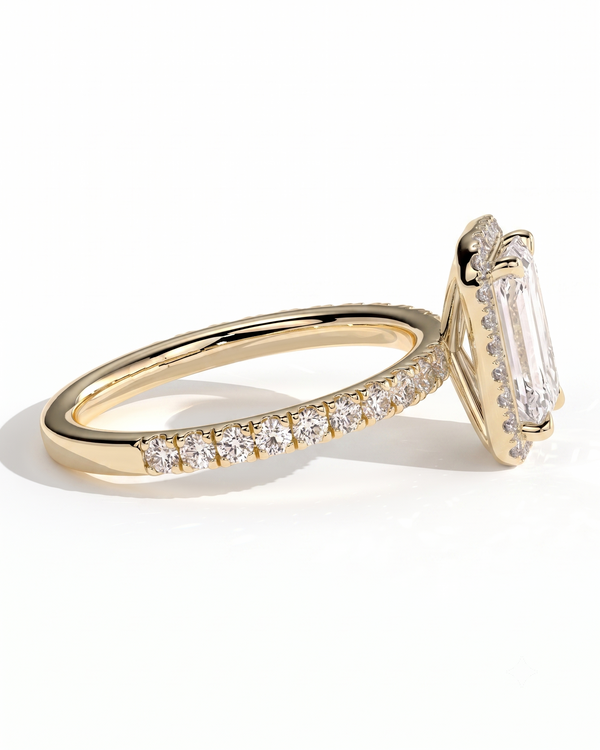 color_10K_YG, color_14K_YG &&A yellow gold ring featuring a large rectangular baguette-cut clear center stone and a pave band set with small round stones, shown on a clean white background.