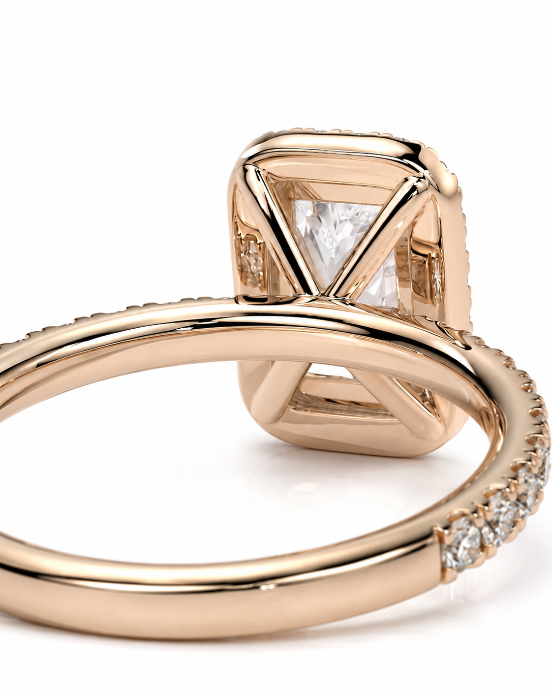 color_10K_RG, color_14K_RG &&Close-up of a rose gold ring with a square bezel-set clear gemstone and small pave accents on the band, photographed on a white background.