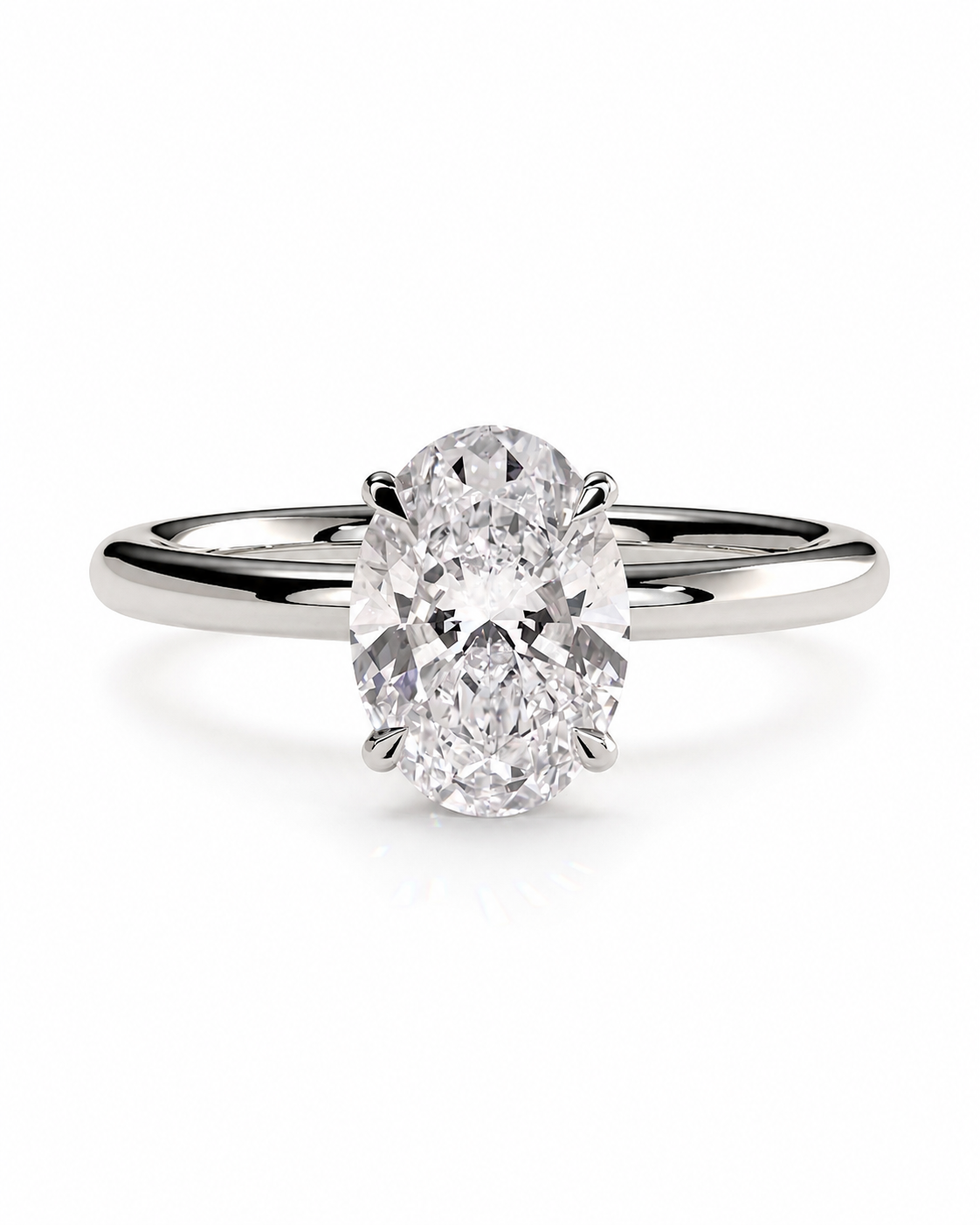 color_925_SIL,color_935_ARG,color_10K_WG, color_14K_WG &&An oval diamond solitaire engagement ring with a brilliant-cut center stone set in a polished silver-colored band, shown on a clean white background.