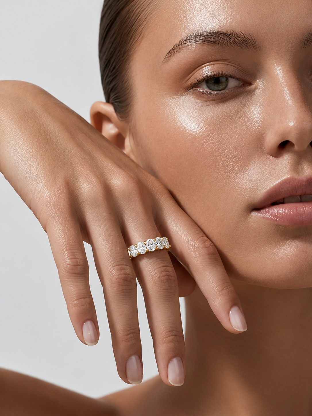 color_10K_YG, color_14K_YG &&Bridal wedding band with oval-cut moissanite in a classic shared prong arrangement.