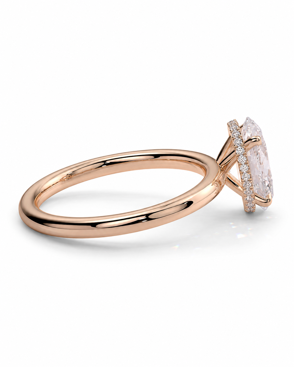 color_10K_RG, color_14K_RG &&Rose gold ring with a large oval clear gemstone and a halo of small diamonds, shown on a clean white background.