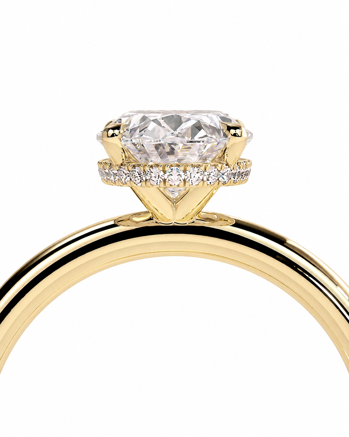 color_10K_YG, color_14K_YG &&A close-up of a yellow gold solitaire engagement ring featuring a large oval-cut center stone and a halo of small round stones, set against a plain white background.
