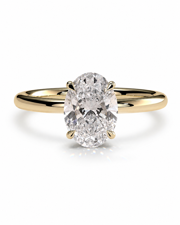 color_10K_YG, color_14K_YG &&An oval diamond engagement ring with a yellow gold band, shown on a clean white background with a soft reflection.