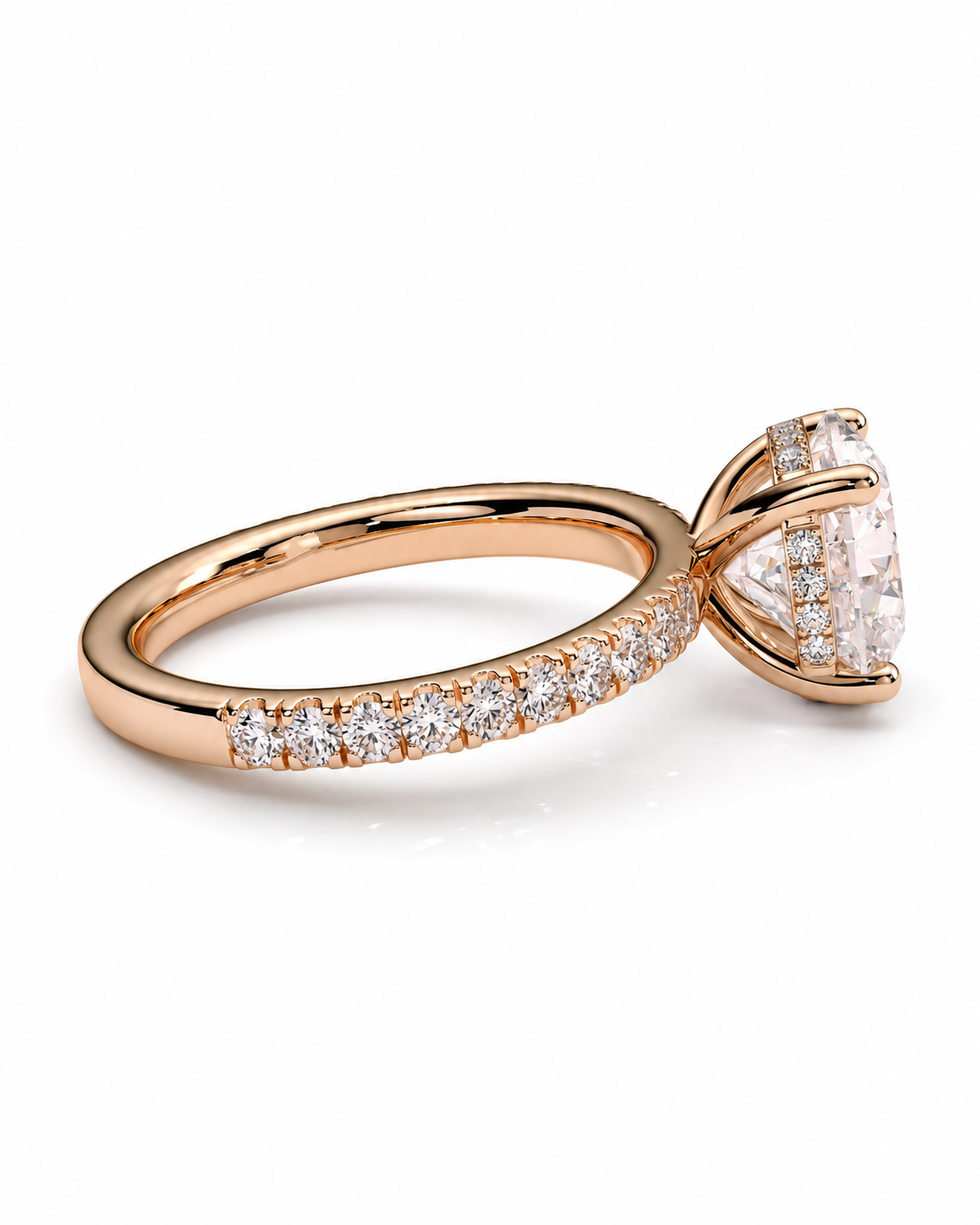 color_10K_RG, color_14K_RG &&A rose gold engagement ring featuring a large pear-cut center stone in a prong setting, with a pave band of small round diamonds on a clean white background.
