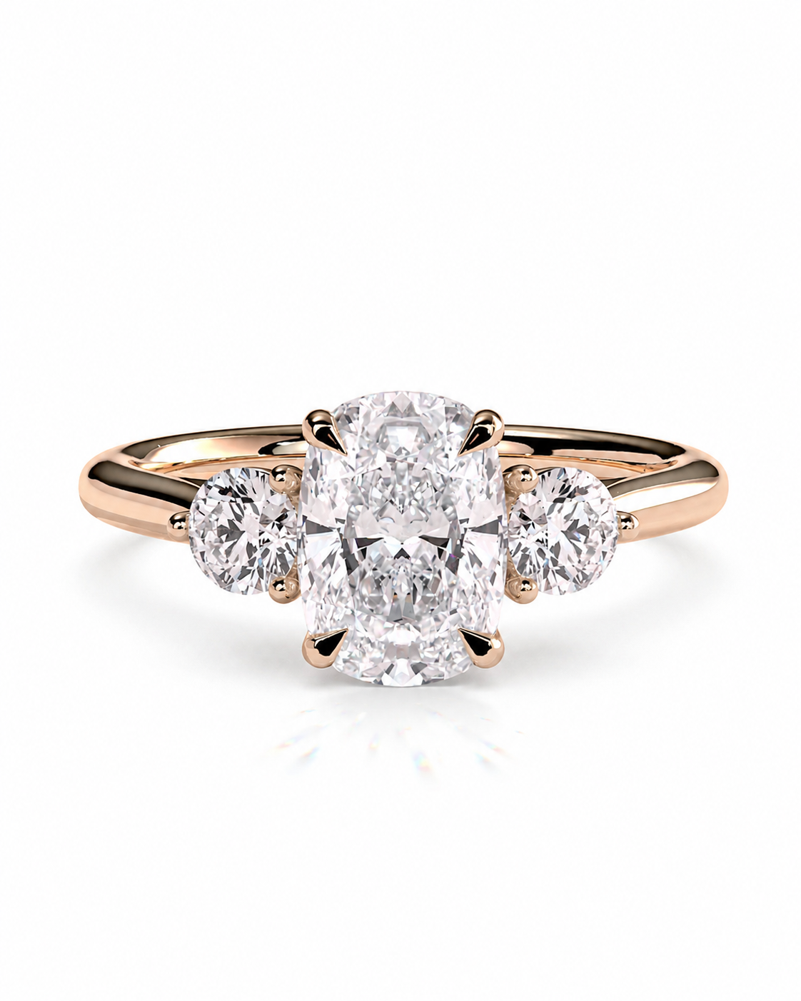 color_10K_RG, color_14K_RG &&A rose gold three-stone engagement ring featuring a large oval center diamond flanked by two smaller round diamonds, set against a clean white background.