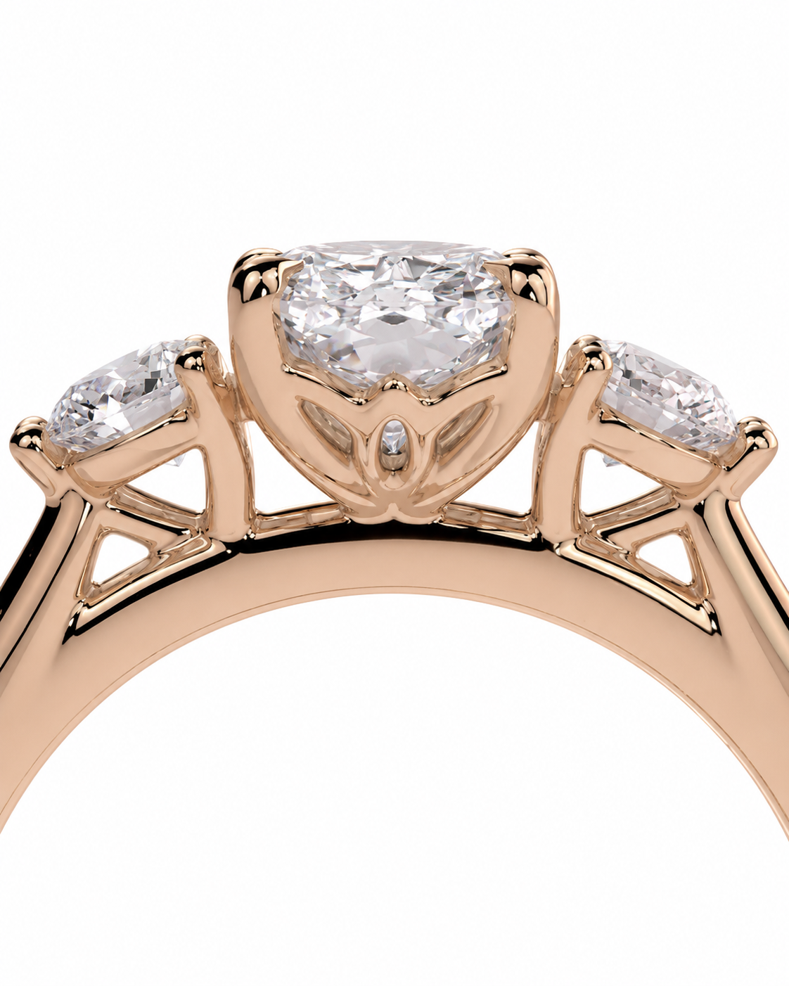 color_10K_RG, color_14K_RG &&A close-up of a rose gold ring featuring a marquise-cut center stone and two smaller round side stones, set against a plain white background.