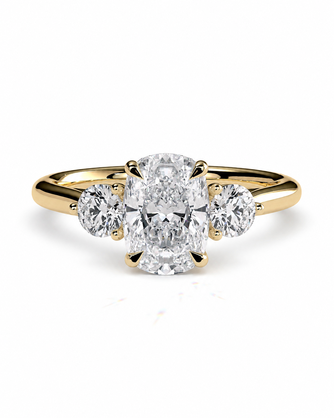 color_10K_YG, color_14K_YG &&A yellow gold three-stone engagement ring featuring a large oval center diamond flanked by two round side diamonds, set against a clean white background.
