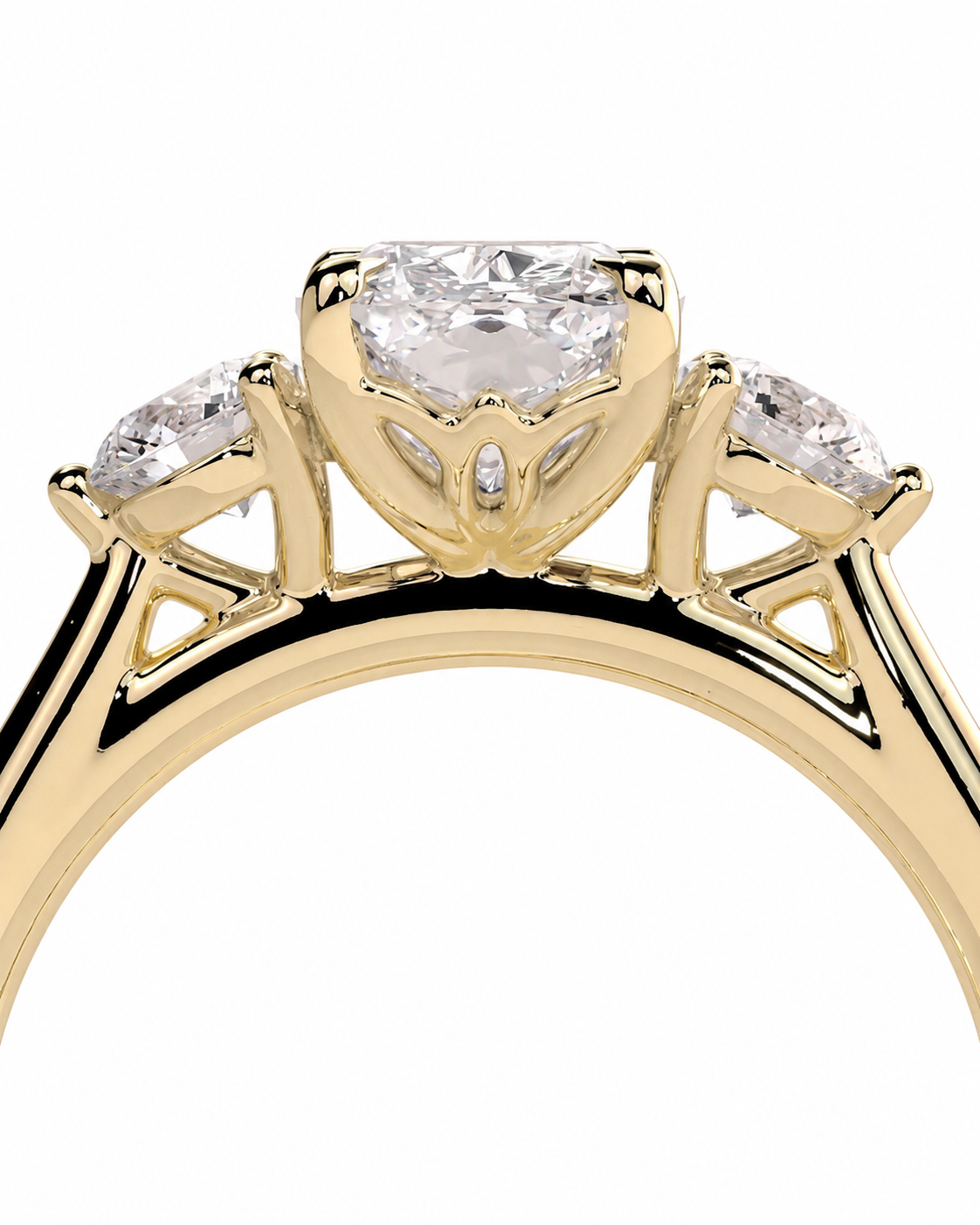 color_10K_YG, color_14K_YG &&A close-up of a yellow gold ring featuring a large cushion-cut center diamond flanked by two marquise-cut side diamonds, set against a plain white background.