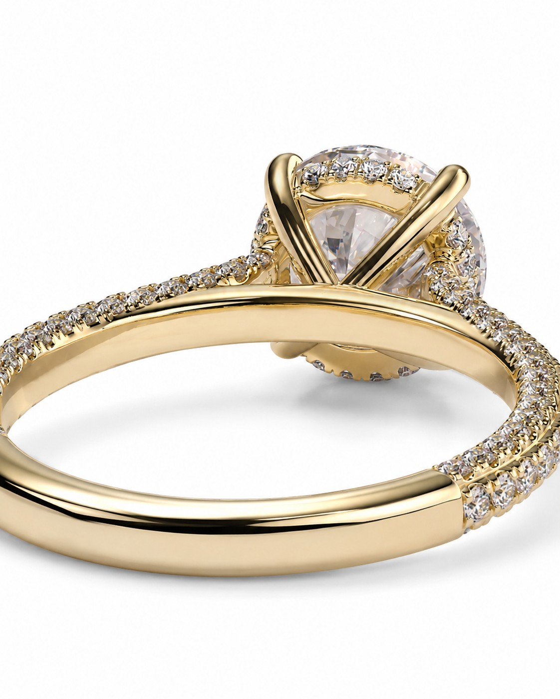 color_10K_YG, color_14K_YG &&A yellow gold engagement ring featuring a large oval clear center stone surrounded by a halo of small clear stones, with a split shank also accented by pave diamonds, shown on a white background.