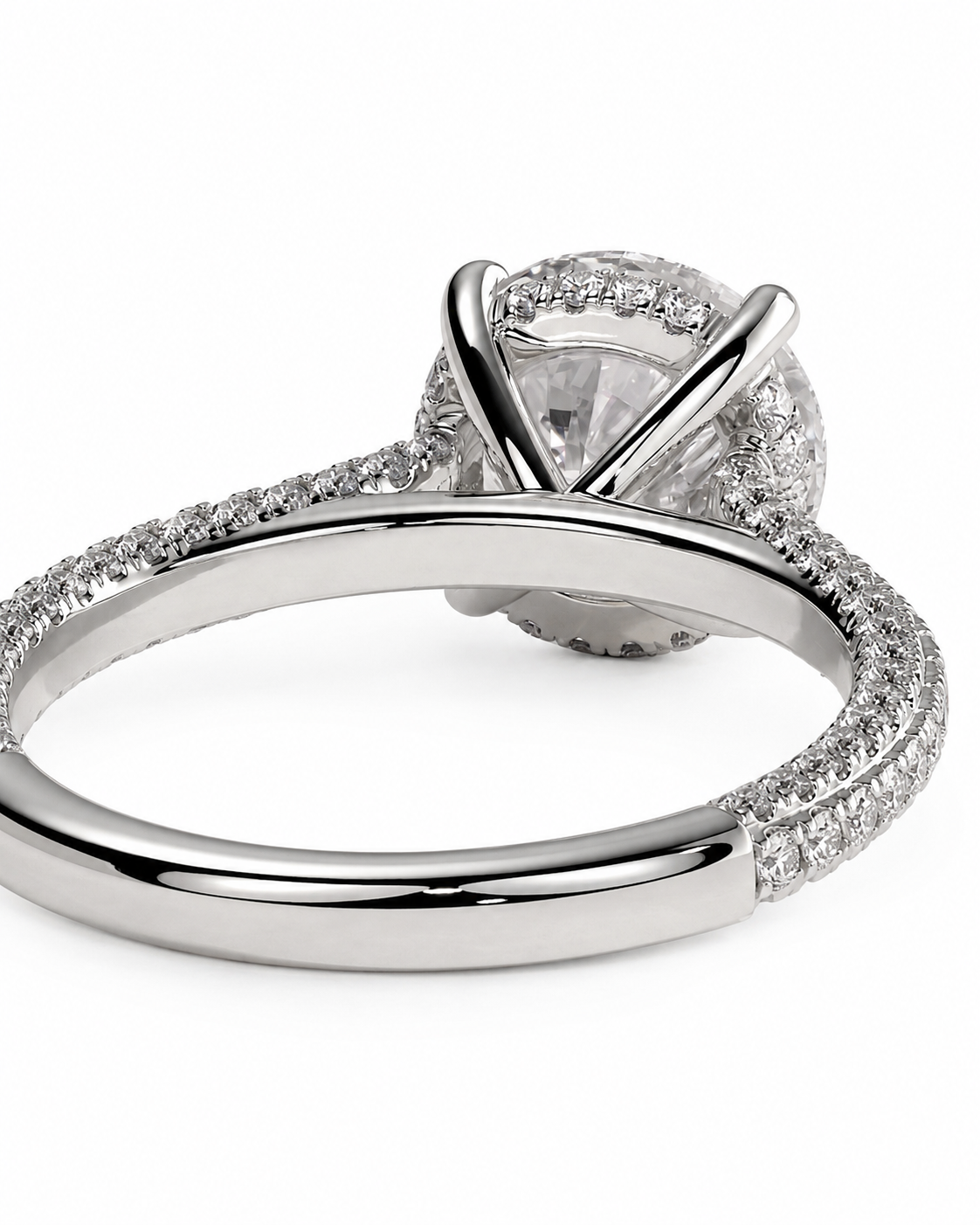 color_925_SIL,color_935_ARG,color_10K_WG, color_14K_WG &&A close-up studio shot of a silver-toned diamond ring with a large round center stone and a halo and pave setting, shown on a plain white background.